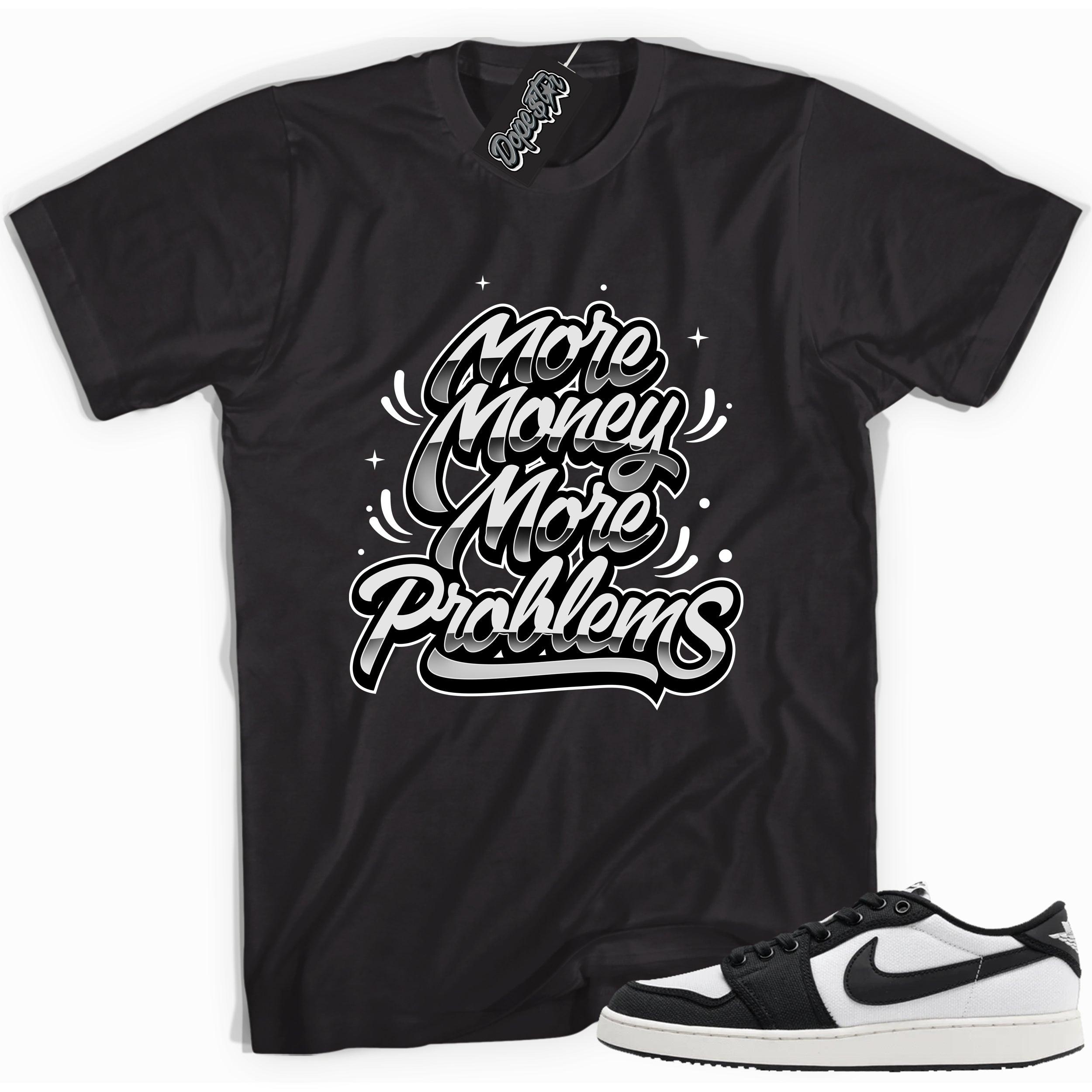 Cool black graphic tee with 'more money more problems' print, that perfectly matches Air Jordan 1 Retro Ajko Low Black & White sneakers.