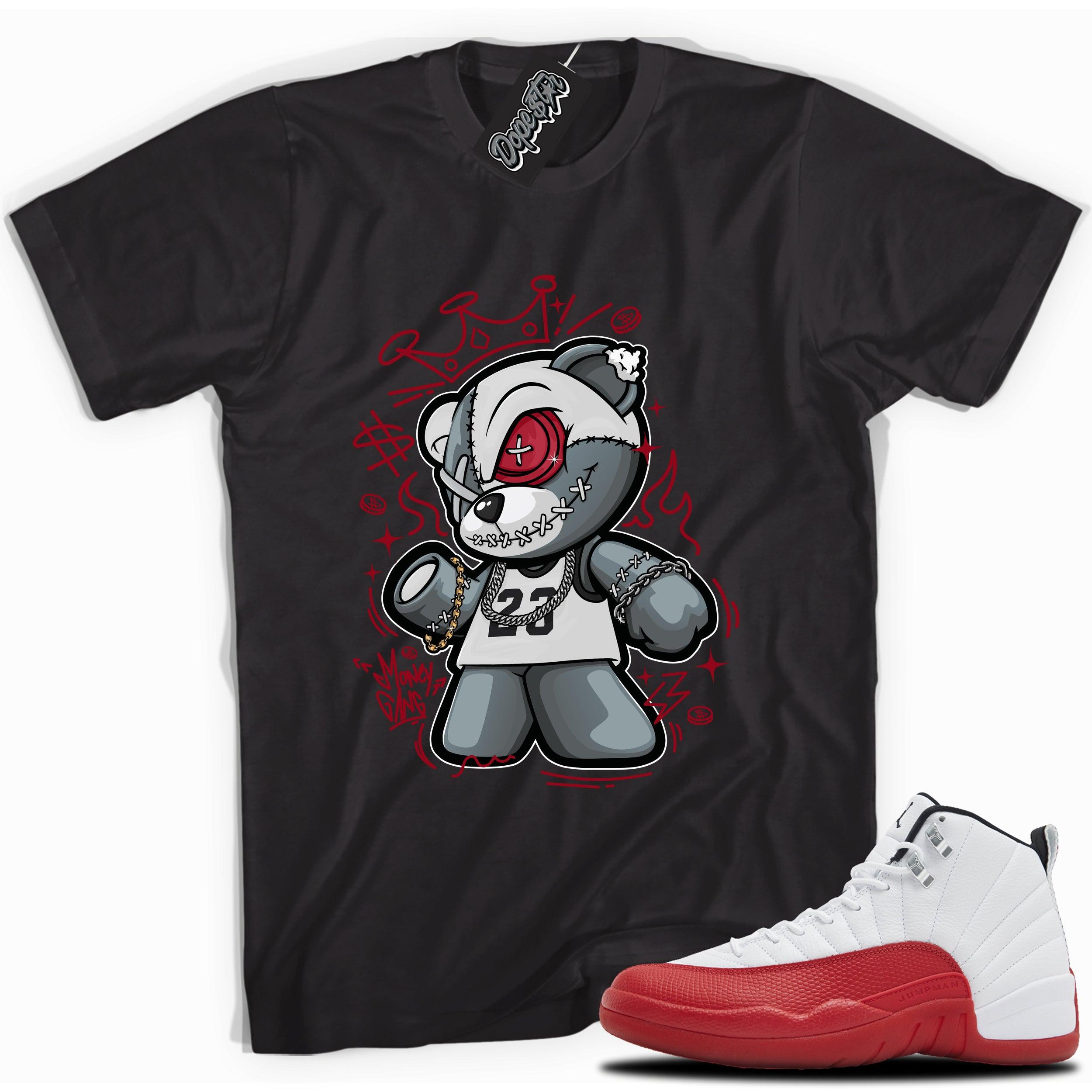 Cool Black graphic tee with “  Money Gang Bear ” print, that perfectly matches Air Jordan 12 Retro Cherry Red 2023 red and white sneakers 