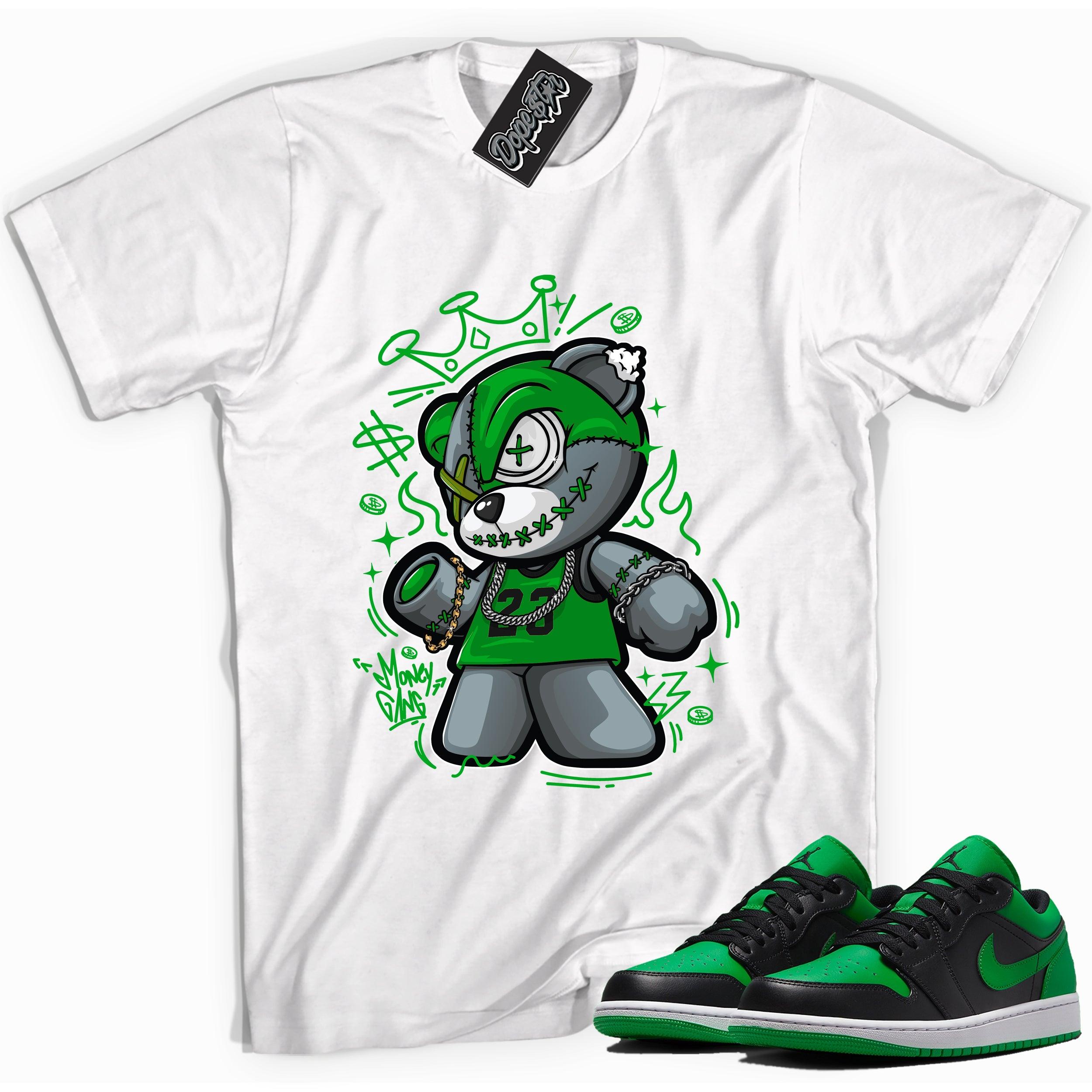 Cool white graphic tee with 'money gang bear' print, that perfectly matches Air Jordan 1 Low Lucky Green sneakers