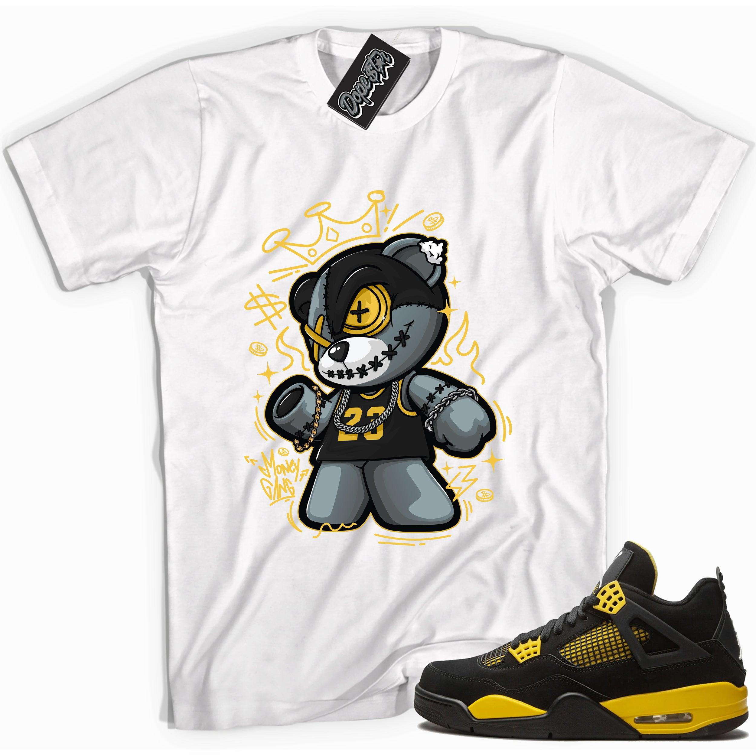Cool white graphic tee with 'money gang bear' print, that perfectly matches Air Jordan 4 Thunder sneakers