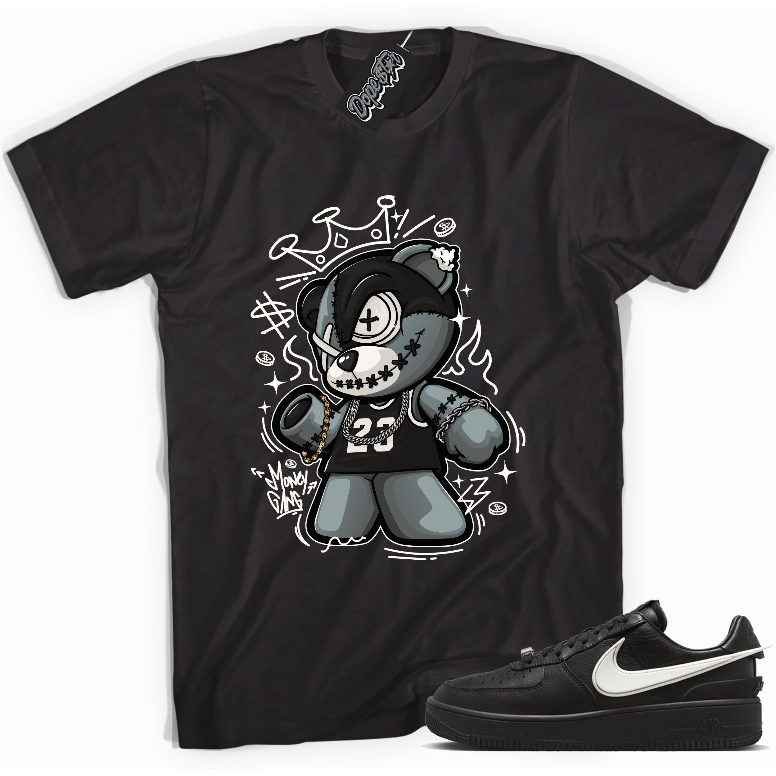 Cool black graphic tee with 'money gang bear' print, that perfectly matches Nike Air Force 1 Low SP Ambush Phantom sneakers.