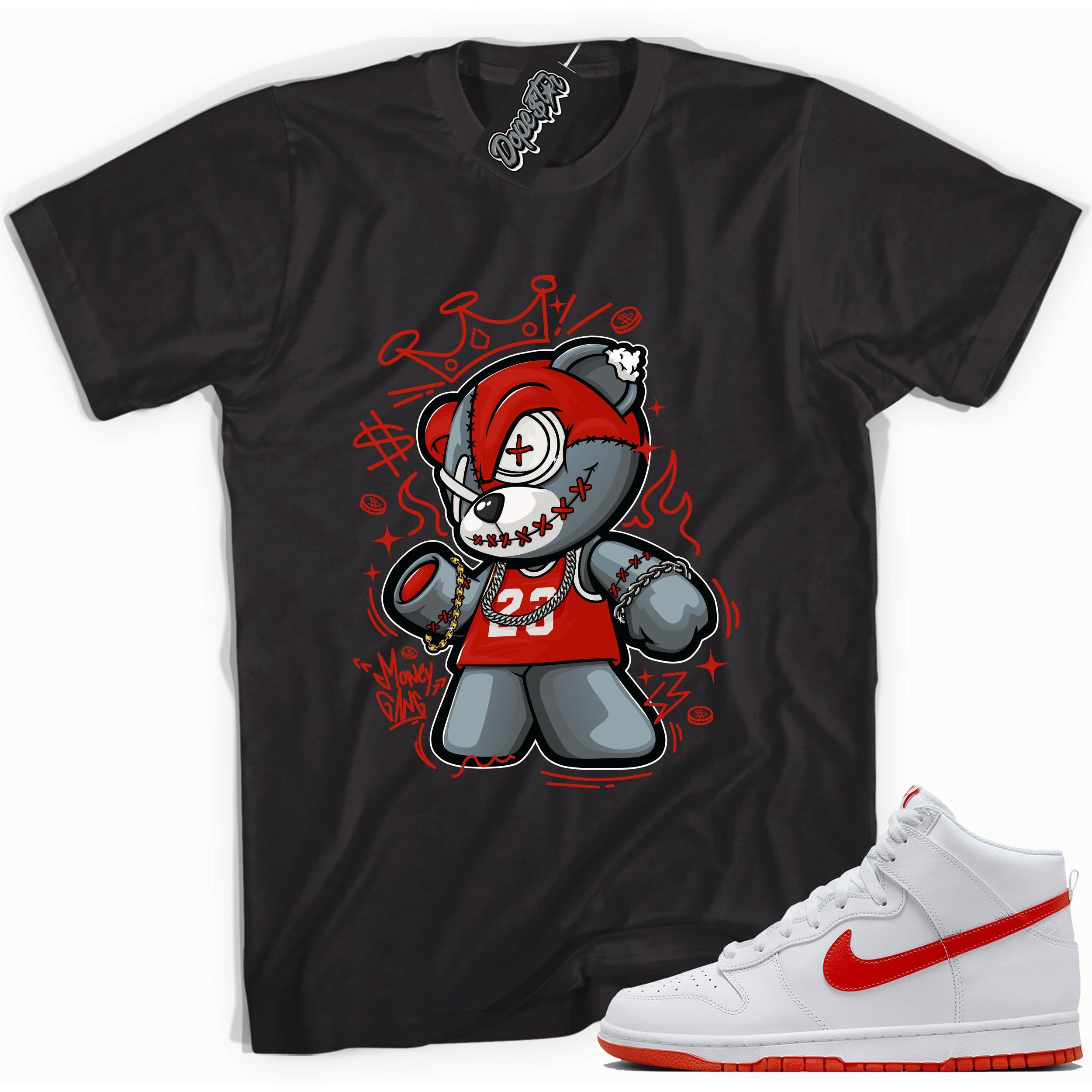 Cool black graphic tee with 'money gang bear' print, that perfectly matches Nike Dunk High White Picante Red sneakers.