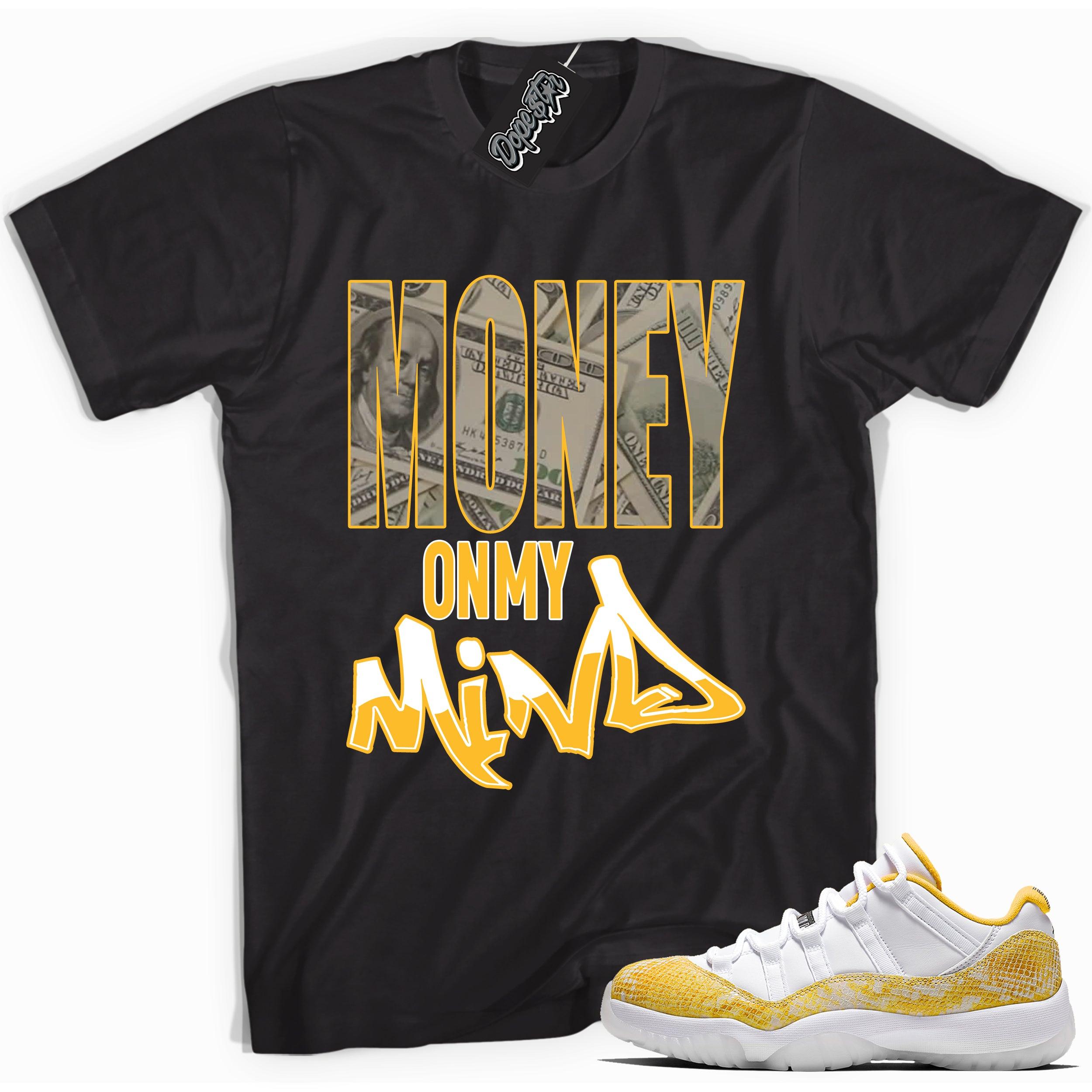 Cool black graphic tee with 'money on my mind' print, that perfectly matches  Air Jordan 11 Low Yellow Snakeskin sneakers