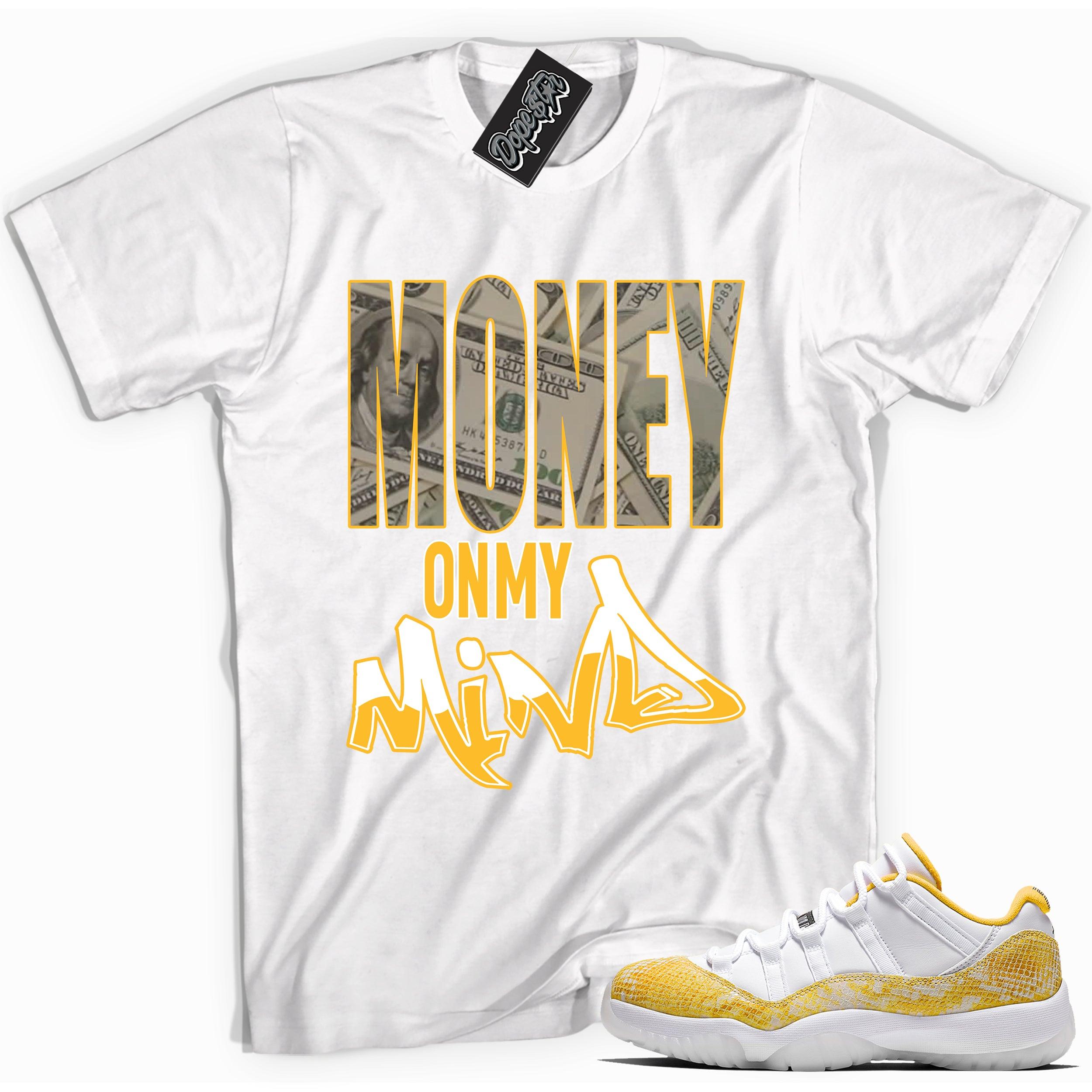 Cool white graphic tee with 'money on my mind' print, that perfectly matches Air Jordan 11 Low Yellow Snakeskin sneakers