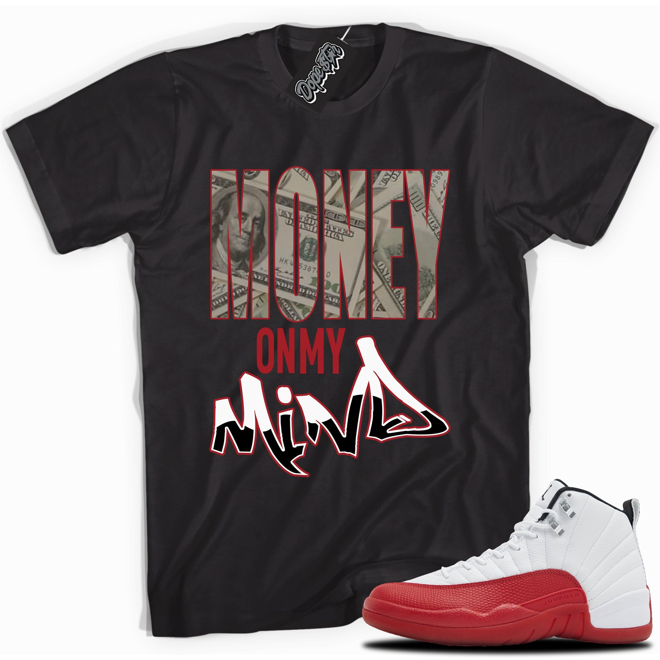 Cool Black graphic tee with “  Money On My Mind ” print, that perfectly matches Air Jordan 12 Retro Cherry Red 2023 red and white sneakers 