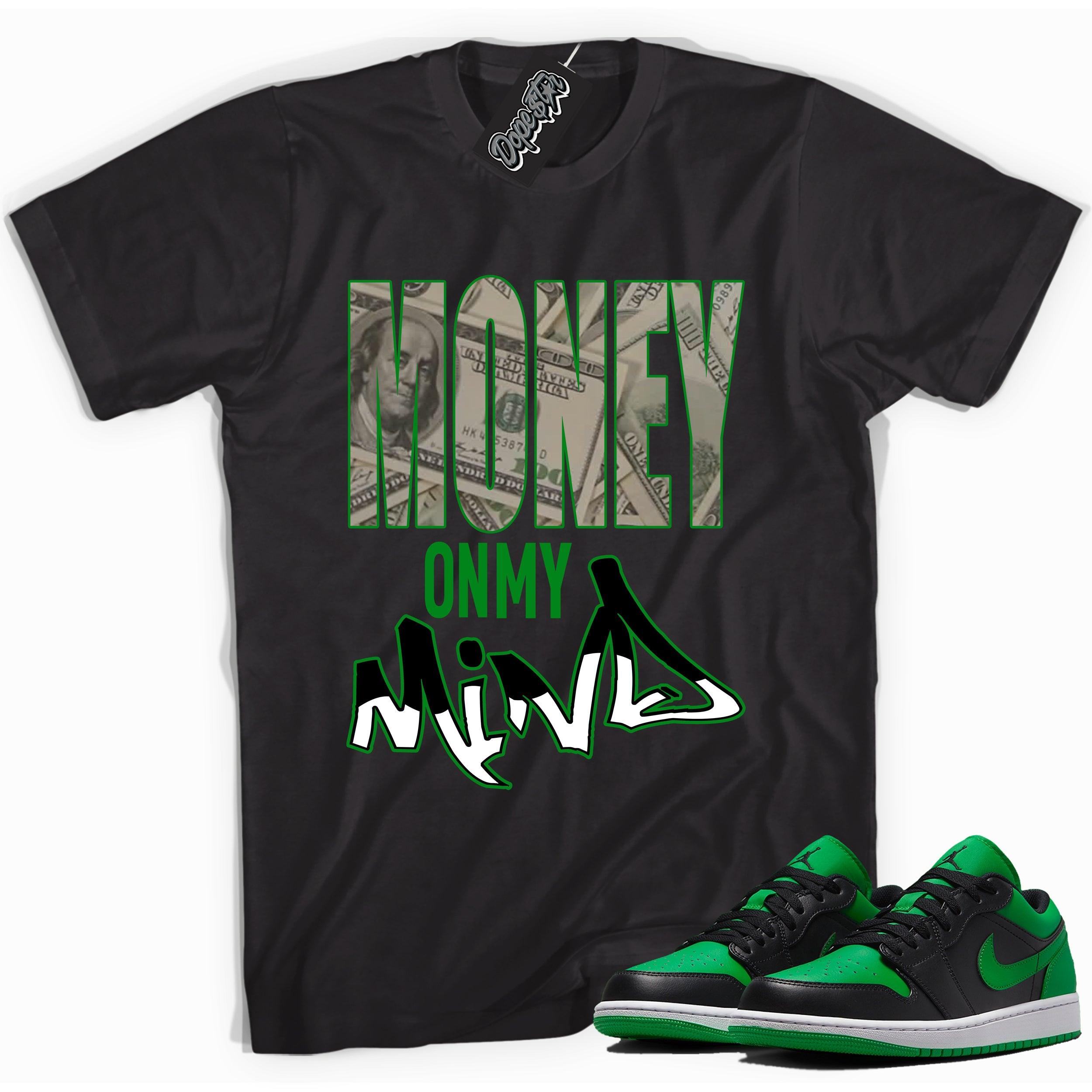 Cool black graphic tee with 'money on my mind' print, that perfectly matches Air Jordan 1 Low Lucky Green sneakers