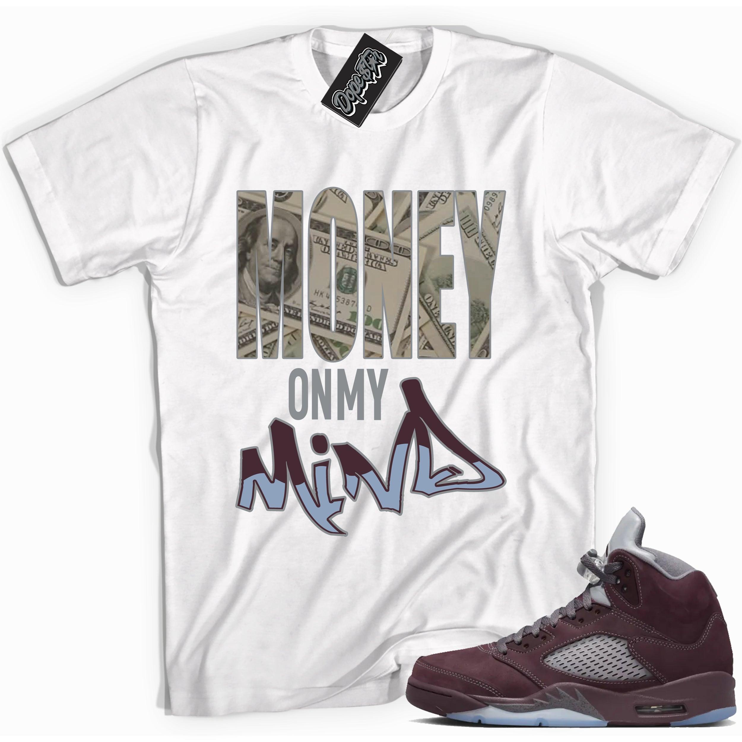 Cool White graphic tee with “ Money On My Mind ” print, that perfectly matches Air Jordan 5 Burgundy 2023 sneakers 