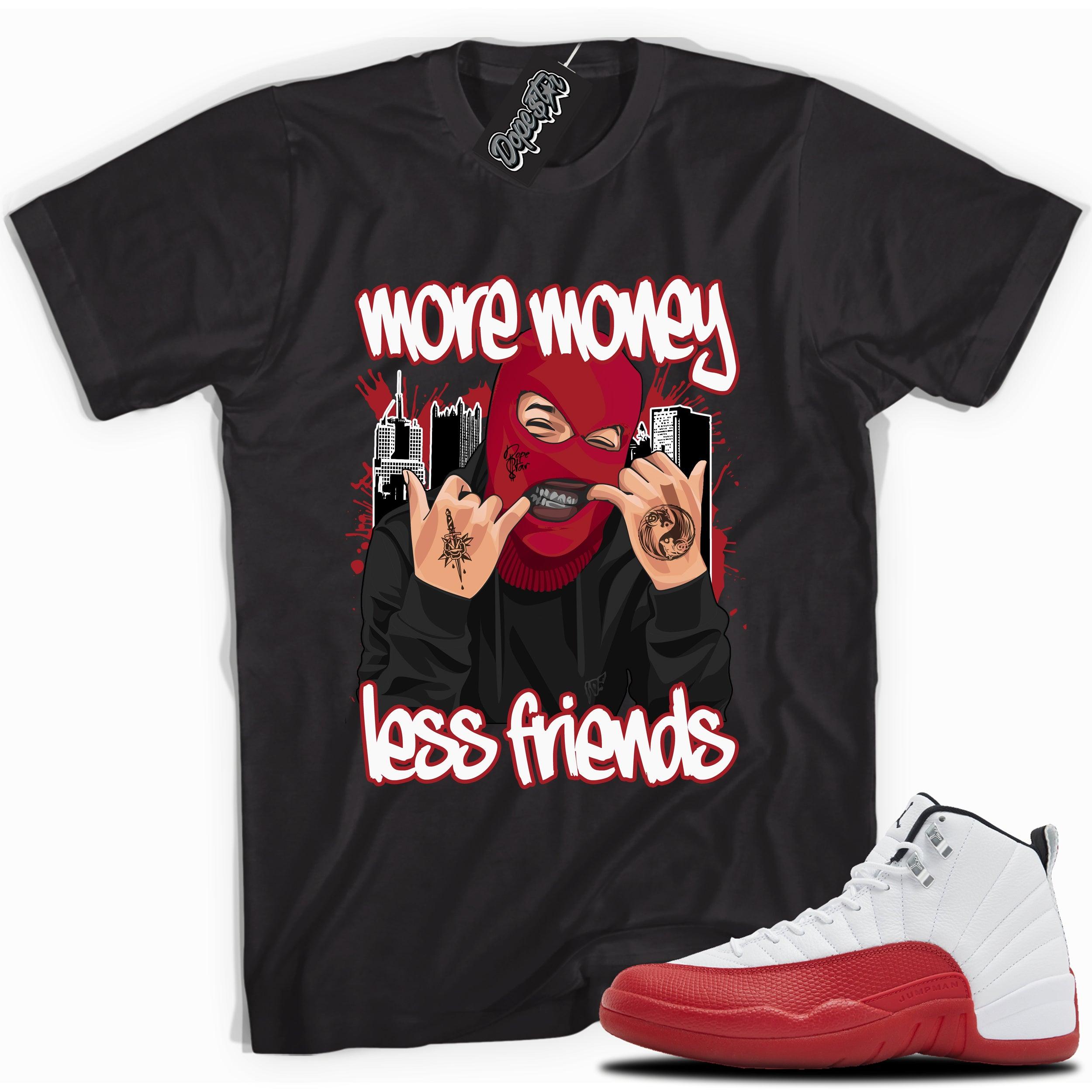 Cool Black graphic tee with “ More Money Less Friends” print, that perfectly matches Air Jordan 12 Retro Cherry Red 2023 red and white sneakers 