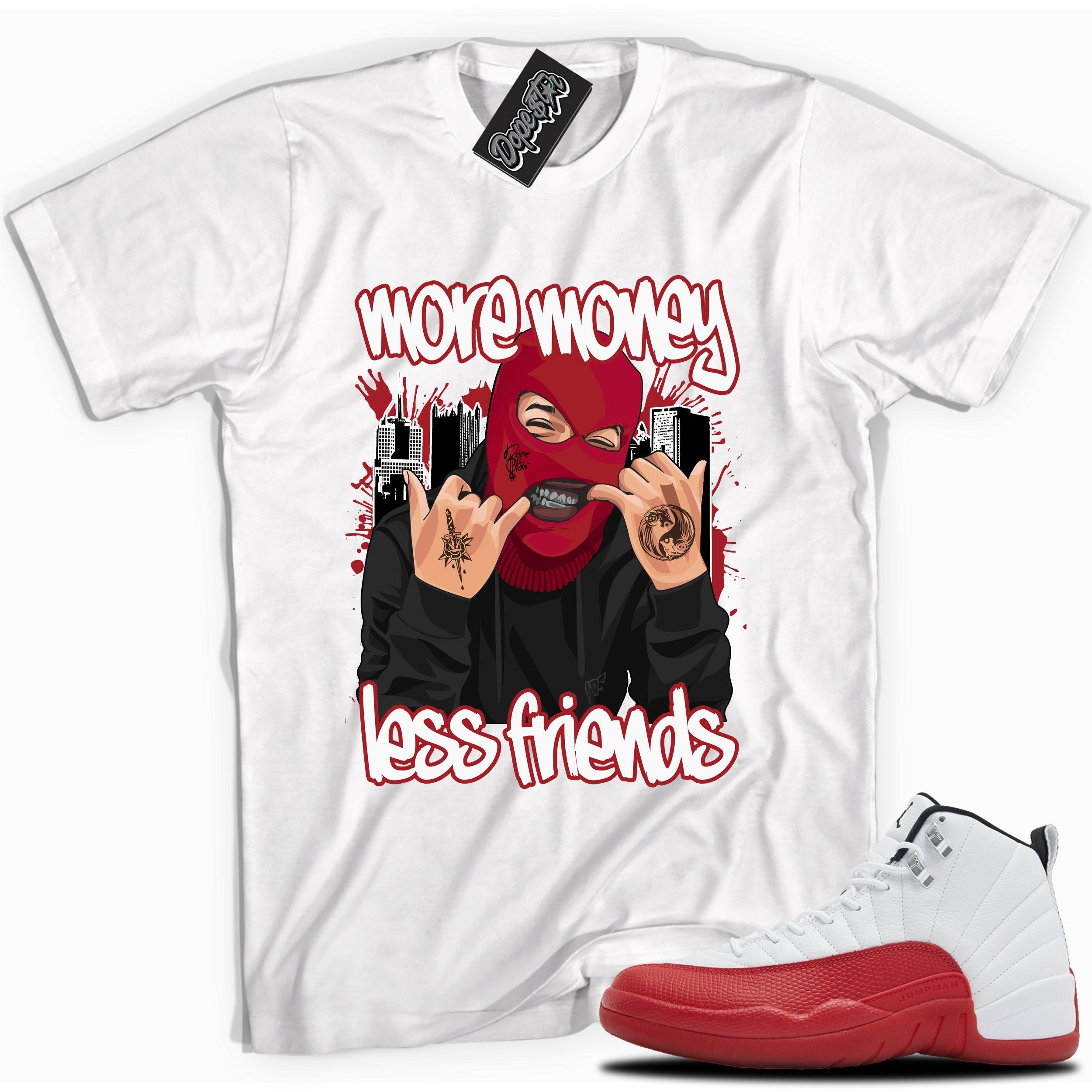 Cool White graphic tee with “ More Money Less Friends” print, that perfectly matches Air Jordan 12 Retro Cherry Red 2023 red and white sneakers 