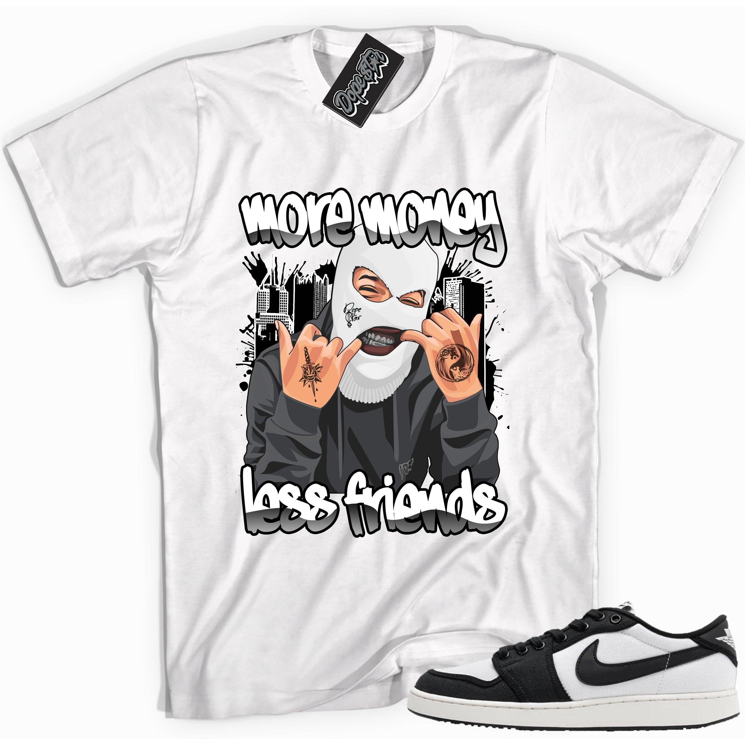 Cool white graphic tee with 'more money less friends' print, that perfectly matches Air Jordan 1 Retro Ajko Low Black & White sneakers.