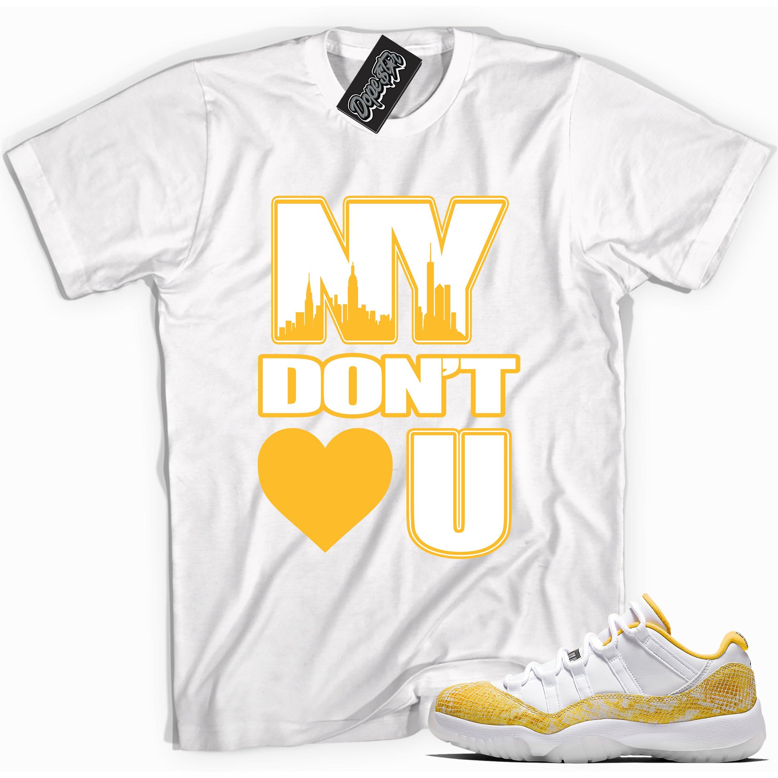 Cool white graphic tee with 'NY Don't <3 U' print, that perfectly matches Air Jordan 11 Low Yellow Snakeskin sneakers