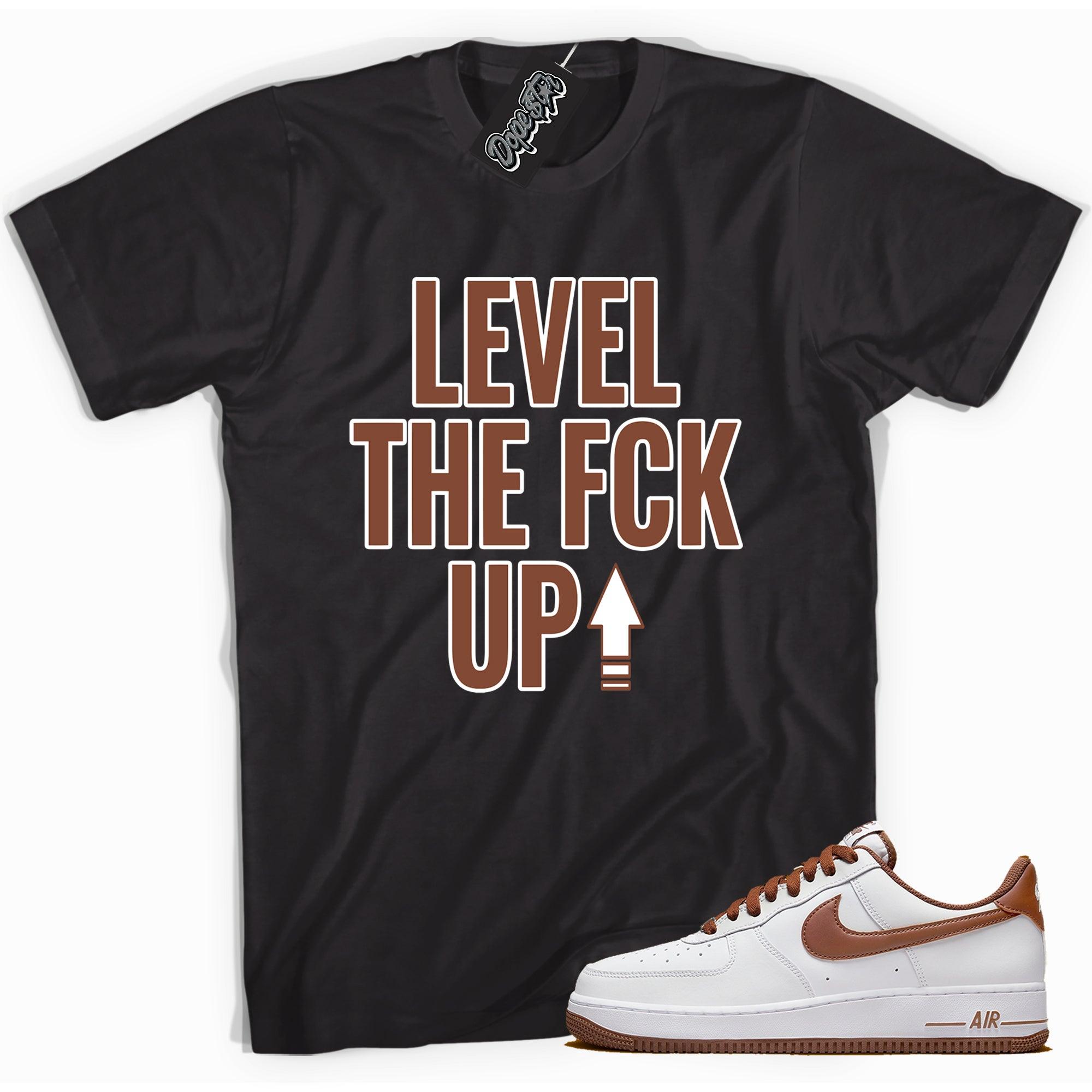 Cool black graphic tee with 'Level Up' print, that perfectly matches  Nike Air Force 1 Low Pecan sneakers.