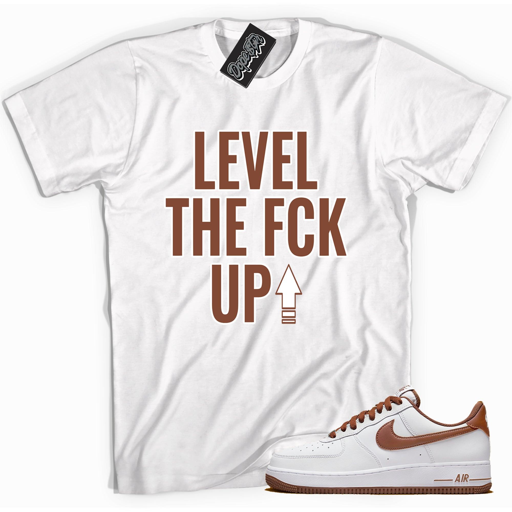Cool white graphic tee with 'Level Up' print, that perfectly matches Nike Air Force 1 Low Pecan sneakers.
