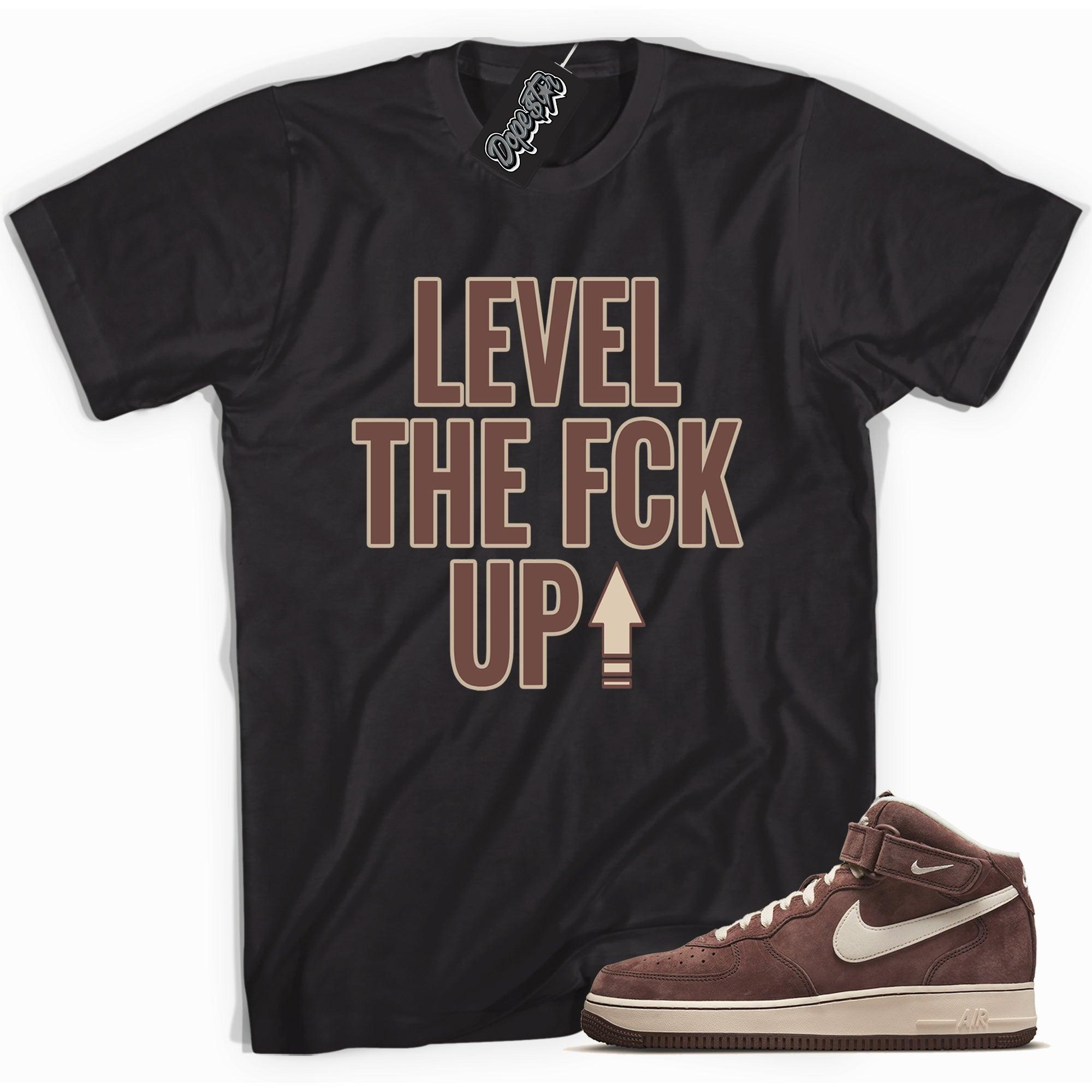 Cool black graphic tee with 'Level Up' print, that perfectly matches Nike Air Force 1 Mid QS Chocolate sneakers.