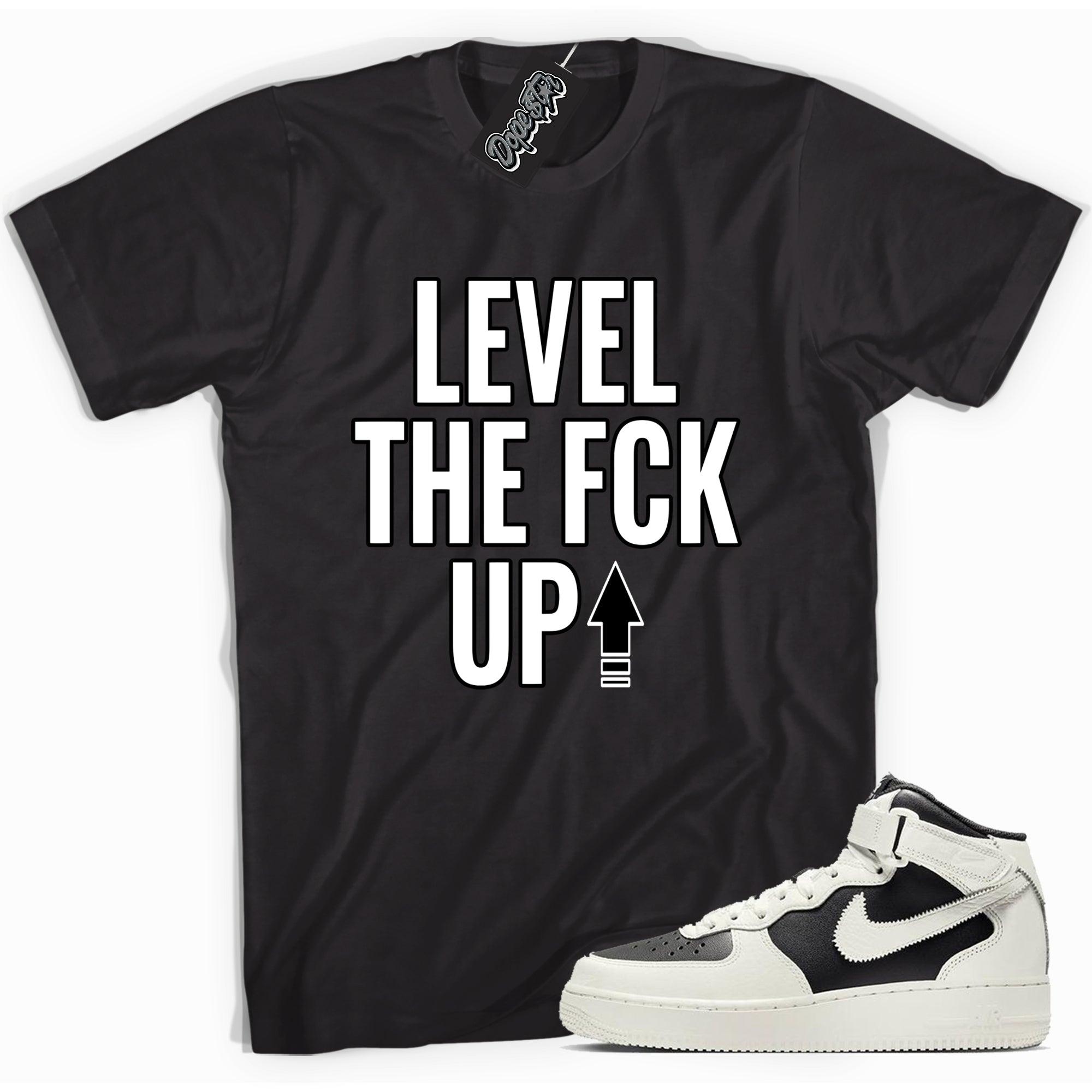 Cool black graphic tee with 'level up' print, that perfectly matches Nike Air Force 1 Mid '07 Every 1 Reverse Panda sneakers.