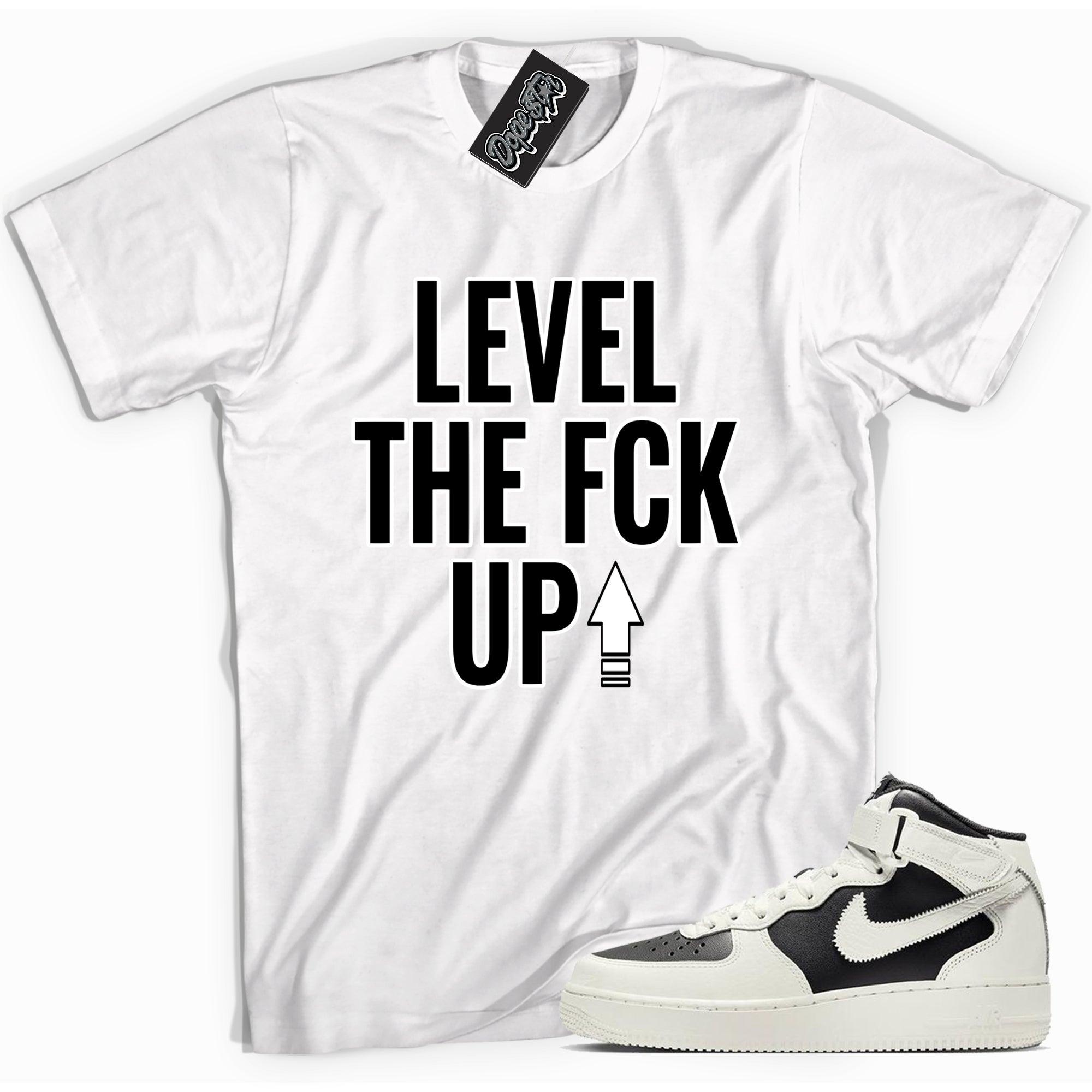 Cool white graphic tee with 'level up' print, that perfectly matches Nike Air Force 1 Mid '07 Every 1 Reverse Panda sneakers.