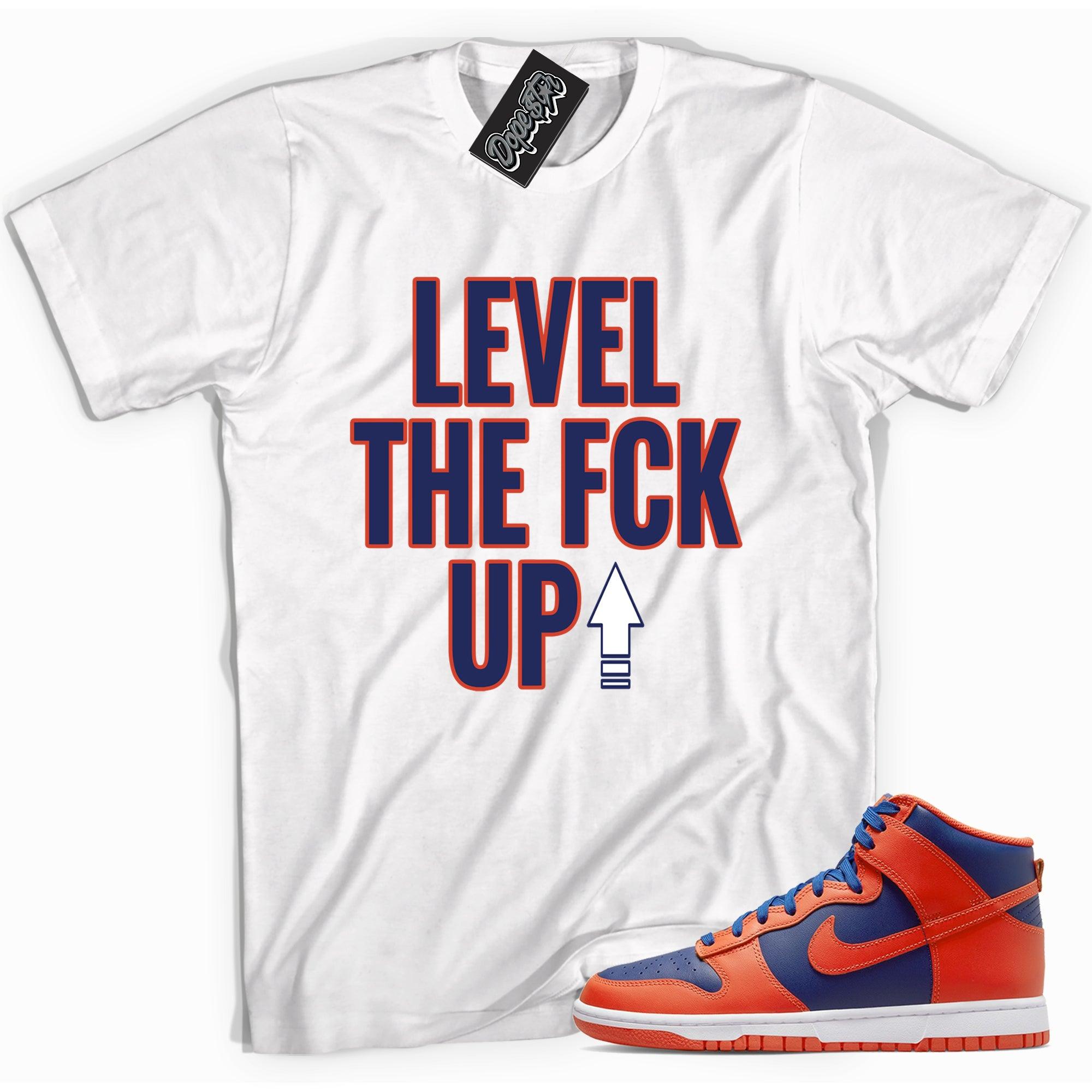 Cool white graphic tee with 'Level Up' print, that perfectly matches Nike Dunk High Knicks sneakers.