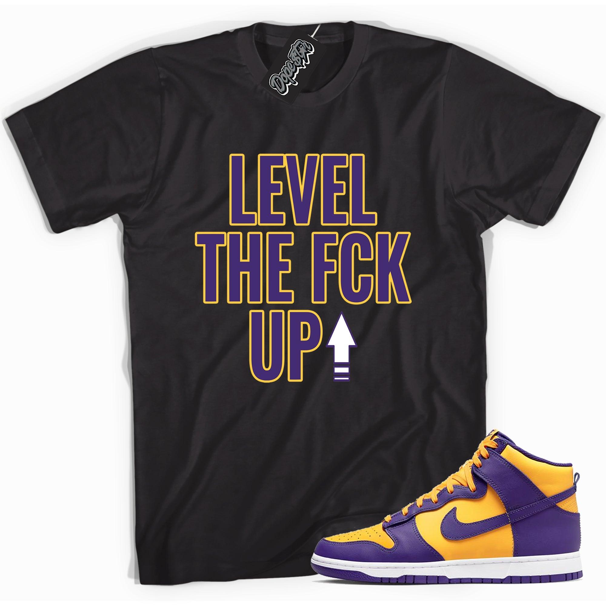 Cool black graphic tee with 'Level Up' print, that perfectly matches Nike Dunk High Lakers sneakers.