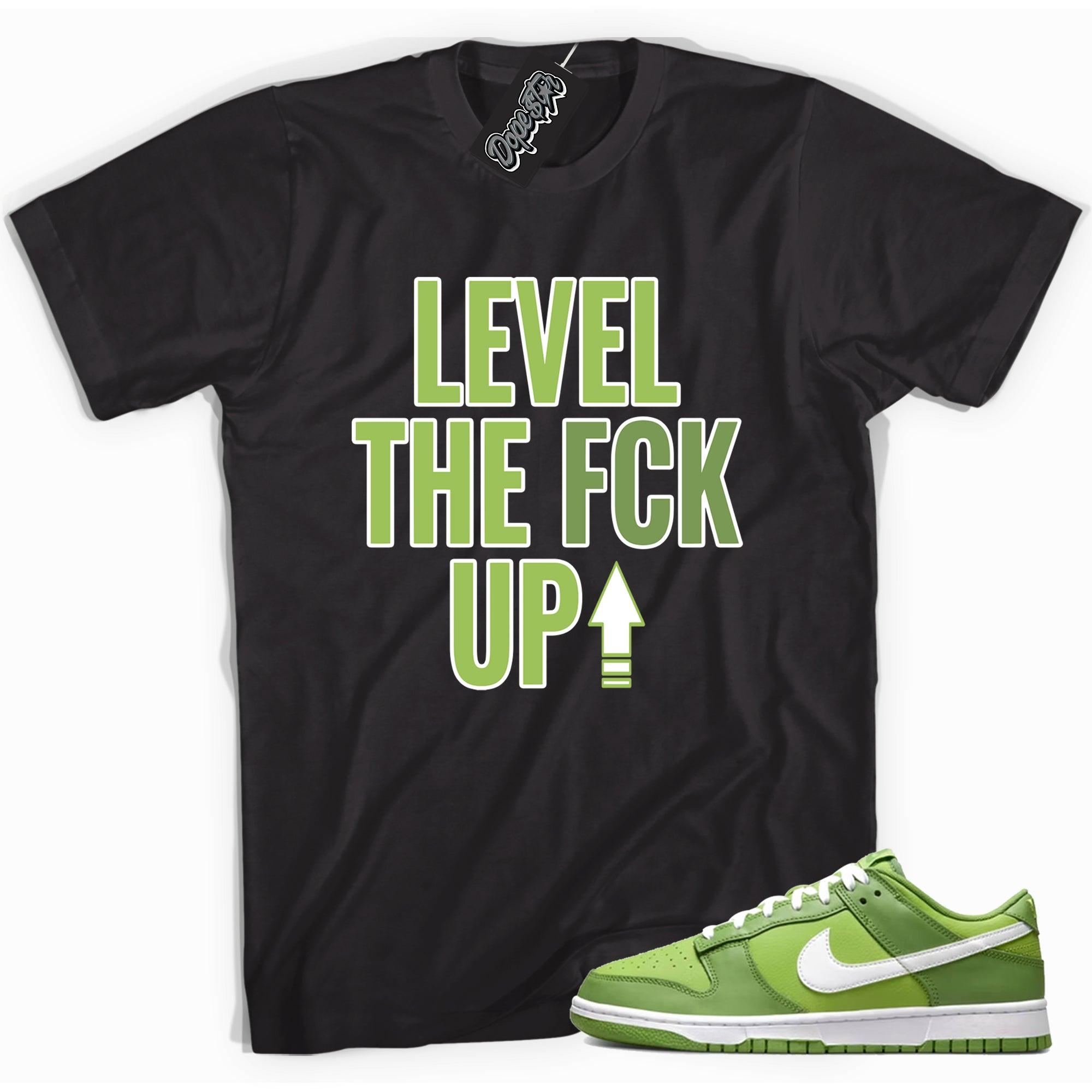 Cool black graphic tee with 'Level Up' print, that perfectly matches Nike Dunk Low Chlorophyll sneakers.