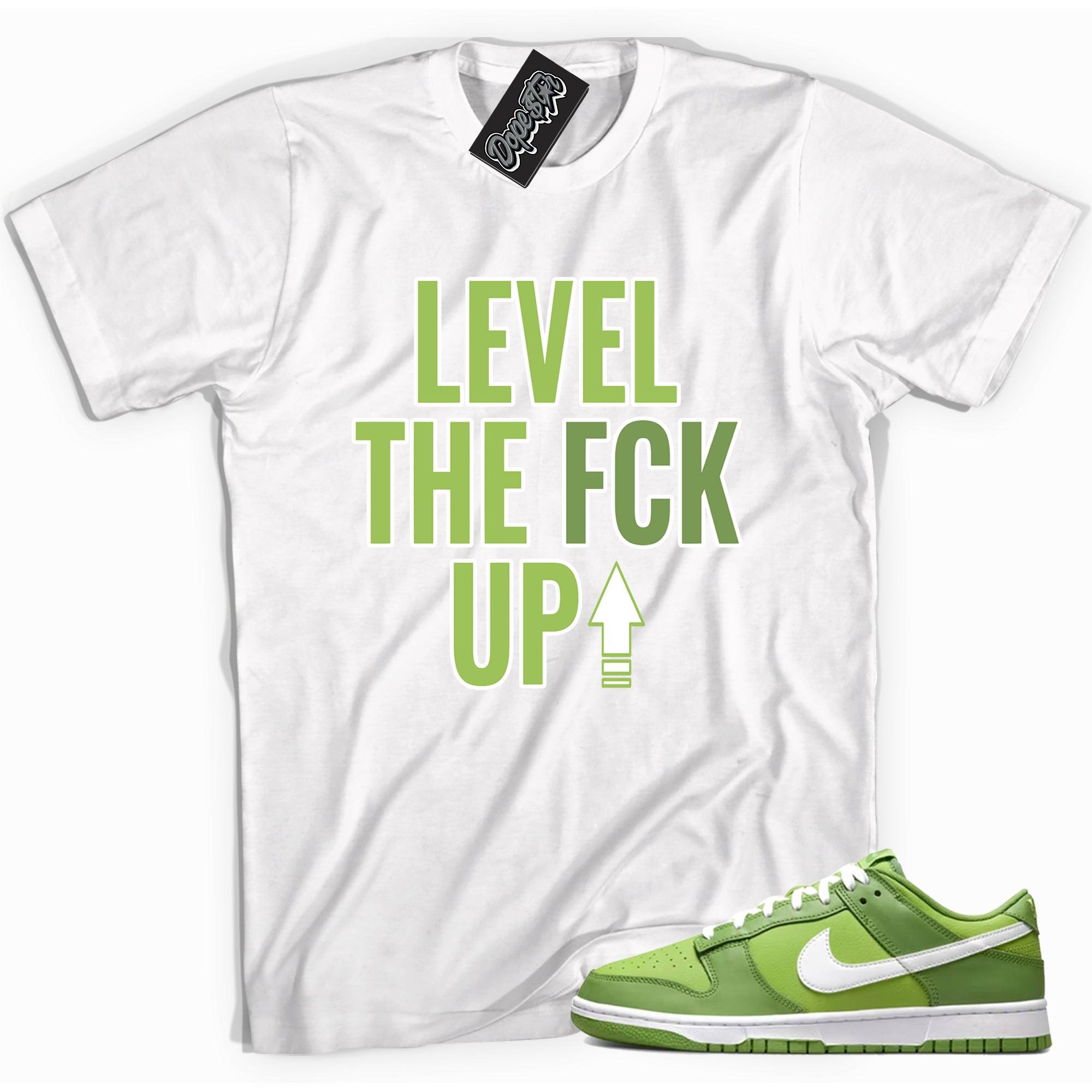 Cool white graphic tee with 'Level Up' print, that perfectly matches Nike Dunk Low Chlorophyll sneakers.