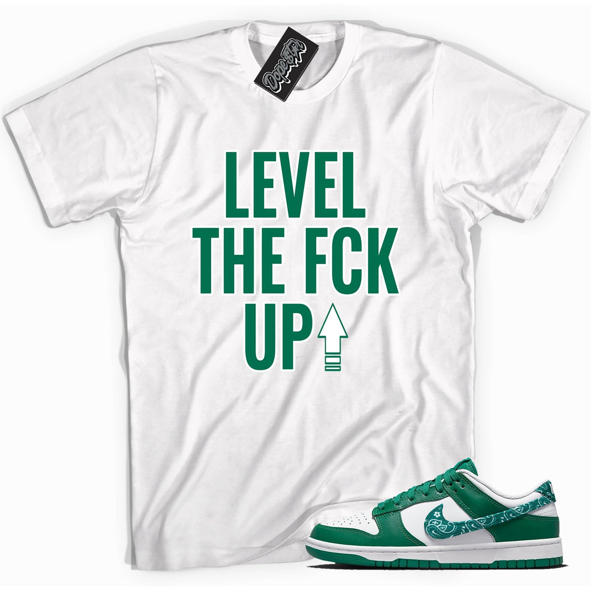 Cool white graphic tee with 'level up' print, that perfectly matches Nike Dunk Low Essential Paisley Pack Green sneakers.
