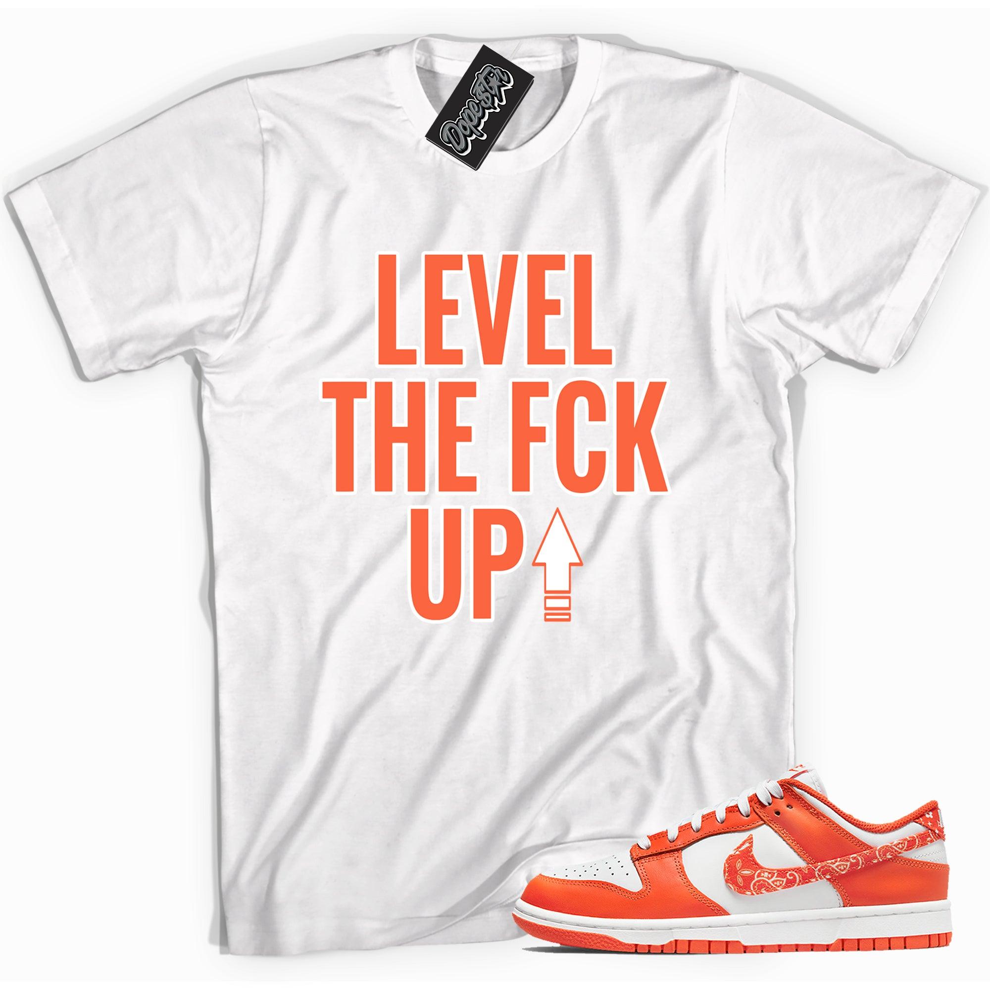 Cool white graphic tee with 'level up' print, that perfectly matches Nike Dunk Low Essential Paisley Pack Orange sneakers.
