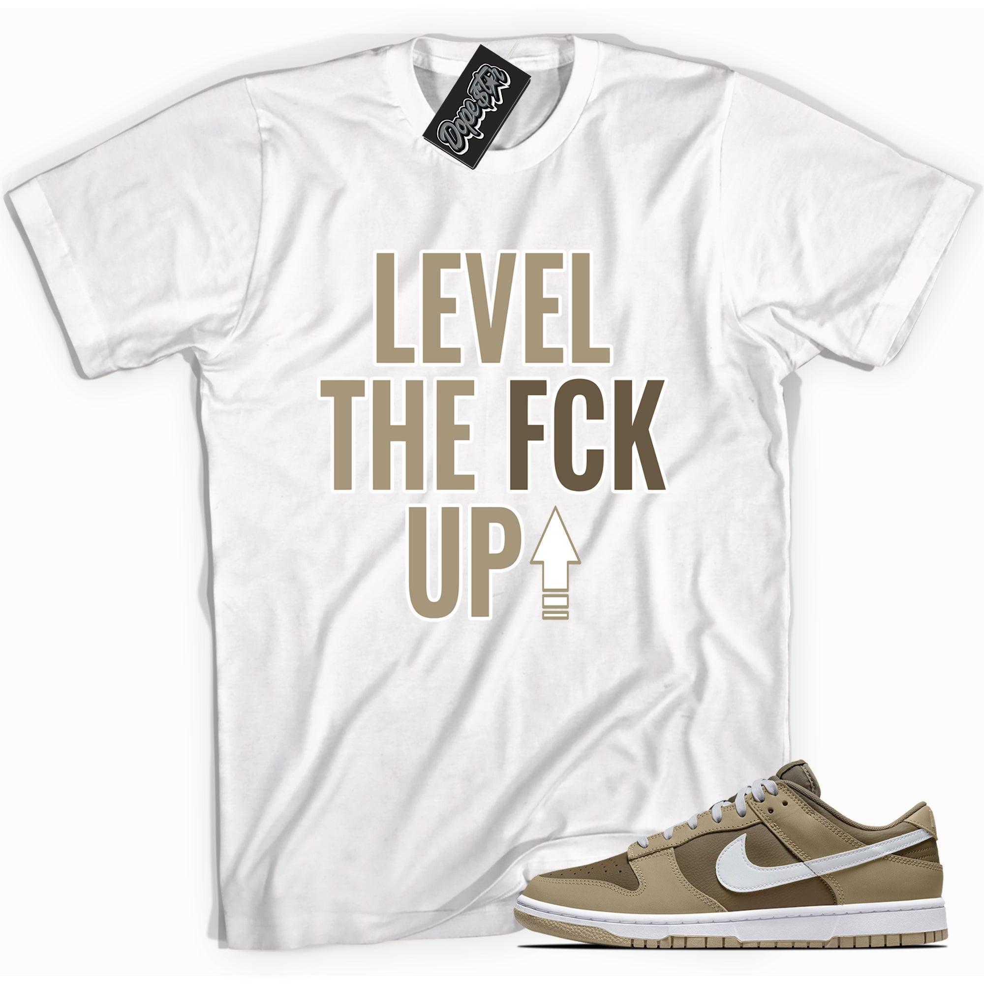 Cool white graphic tee with 'Level Up' print, that perfectly matches Nike Dunk Low Judge Grey sneakers.