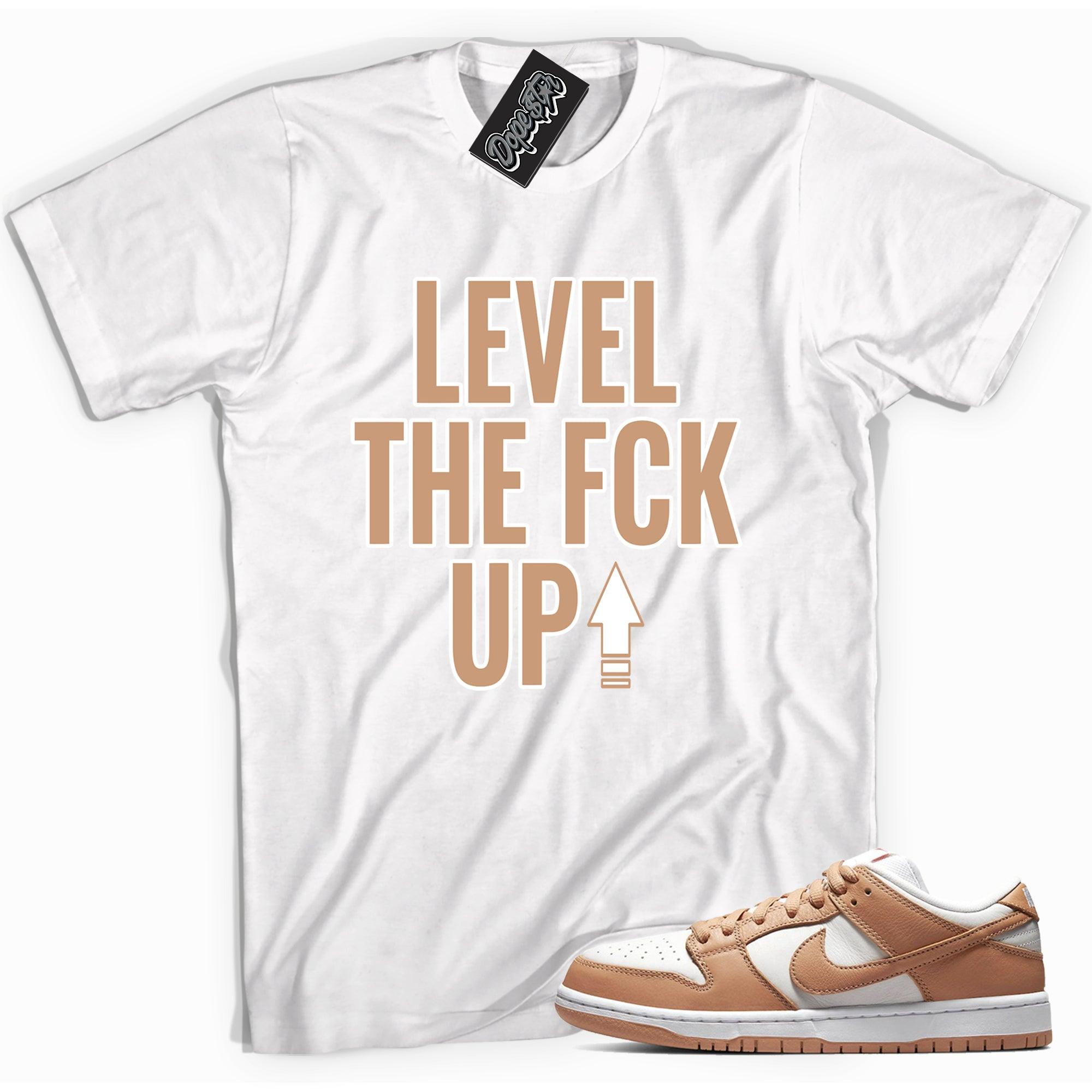 Cool white graphic tee with 'Level Up' print, that perfectly matches Nike Dunk Low Light Cognac sneakers.