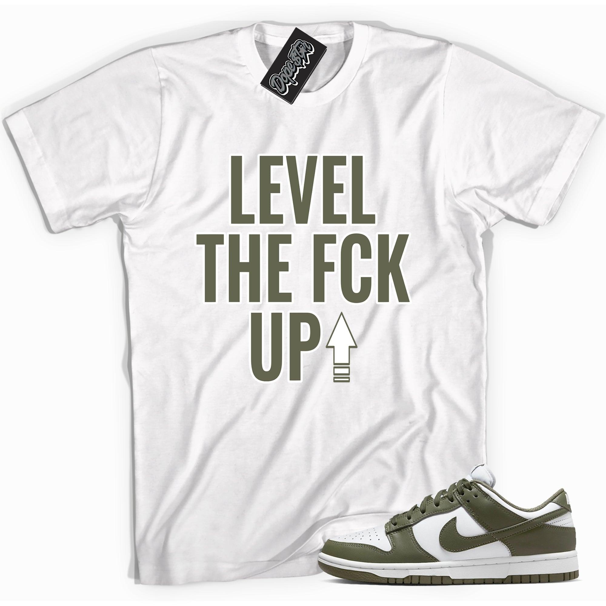 Cool white graphic tee with 'Level Up' print, that perfectly matches Nike Dunk Low Medium Olive sneakers.