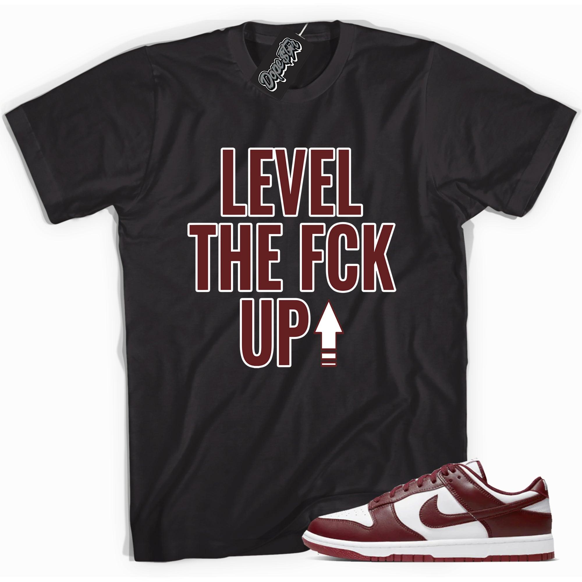 Cool black graphic tee with 'Level Up' print, that perfectly matches Nike Dunk Low Team Red sneakers.