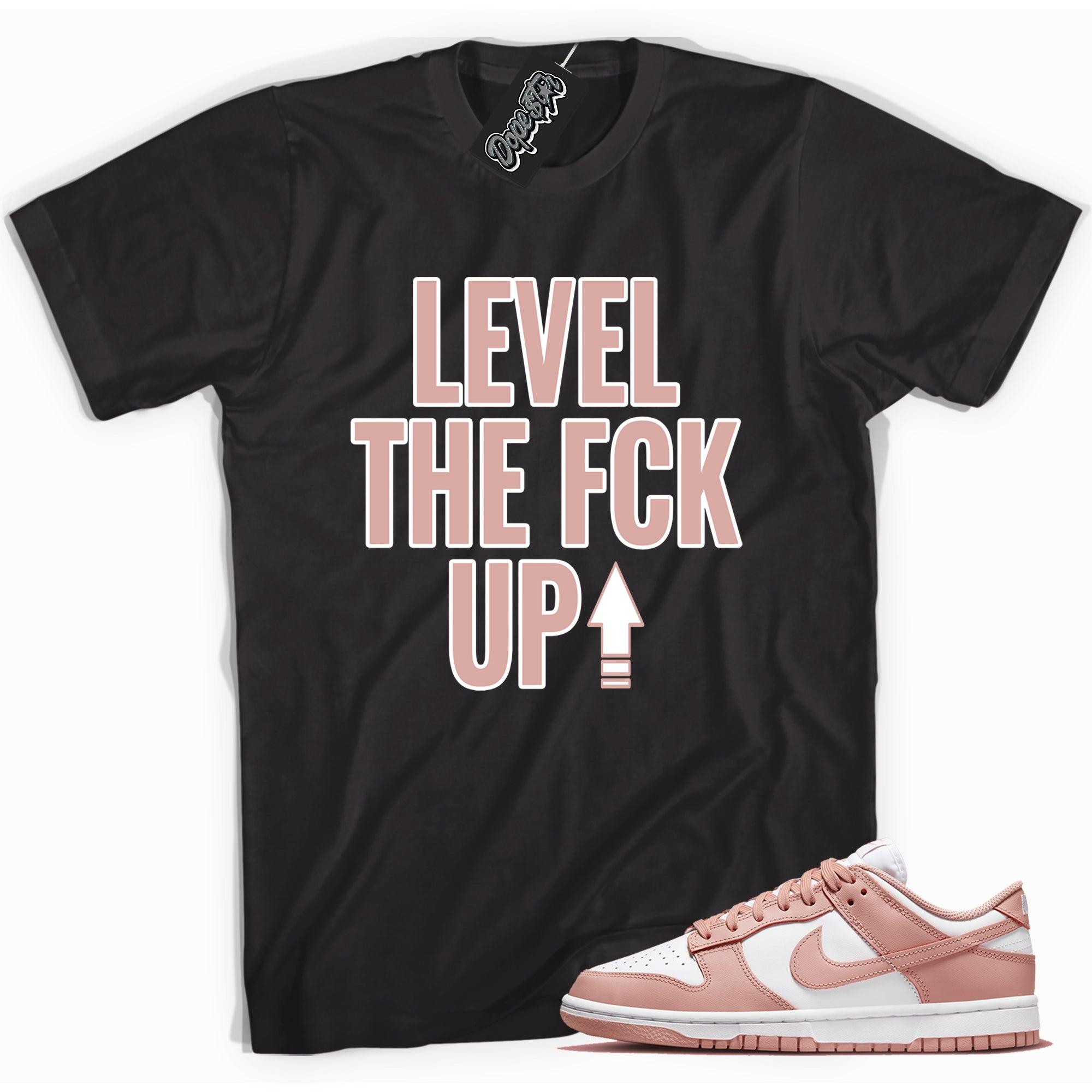 Cool black graphic tee with 'Level Up' print, that perfectly matches Nike Dunk Low Womens Rose Whisper sneakers.
