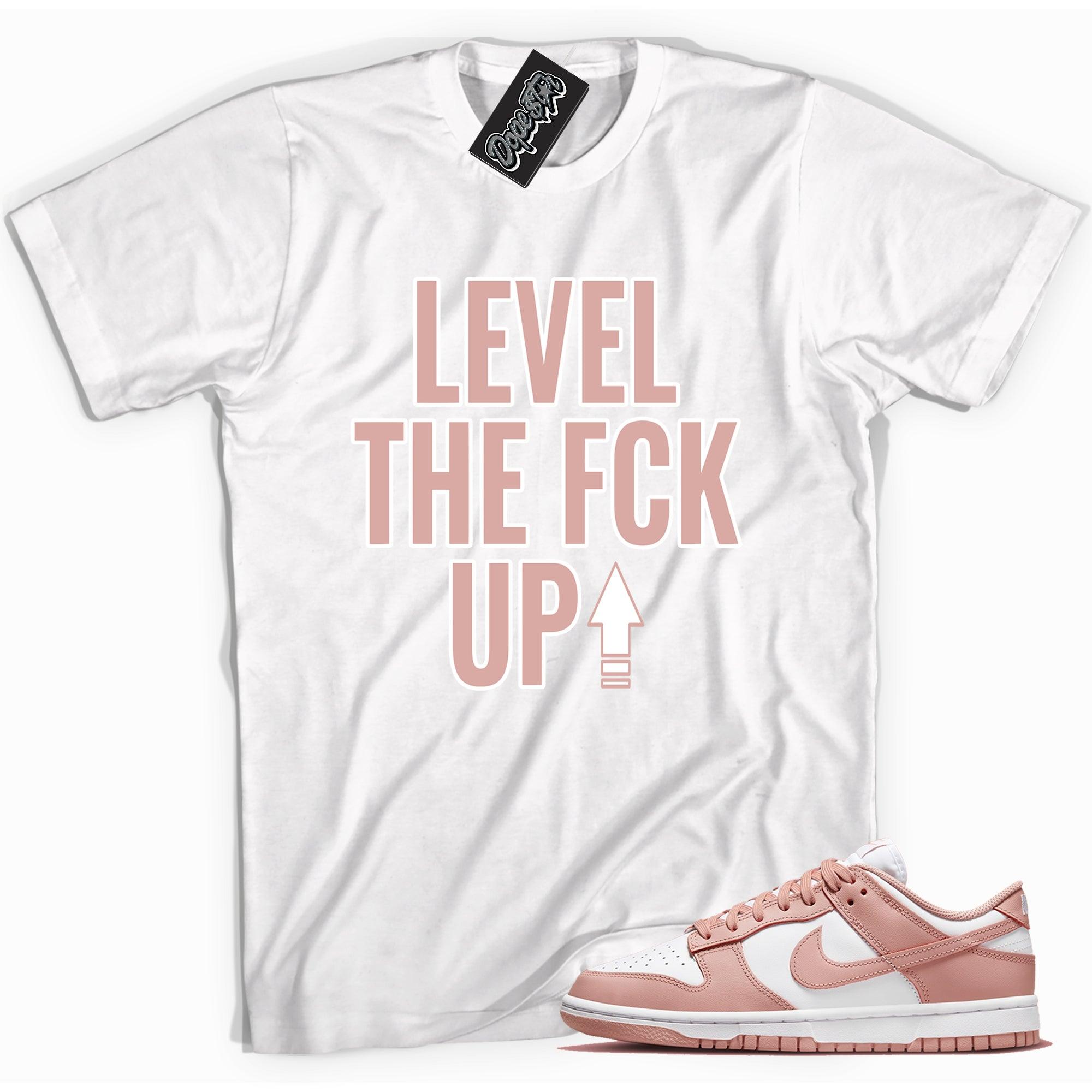 Cool white graphic tee with 'Level Up' print, that perfectly matches Nike Dunk Low Womens Rose Whisper sneakers.