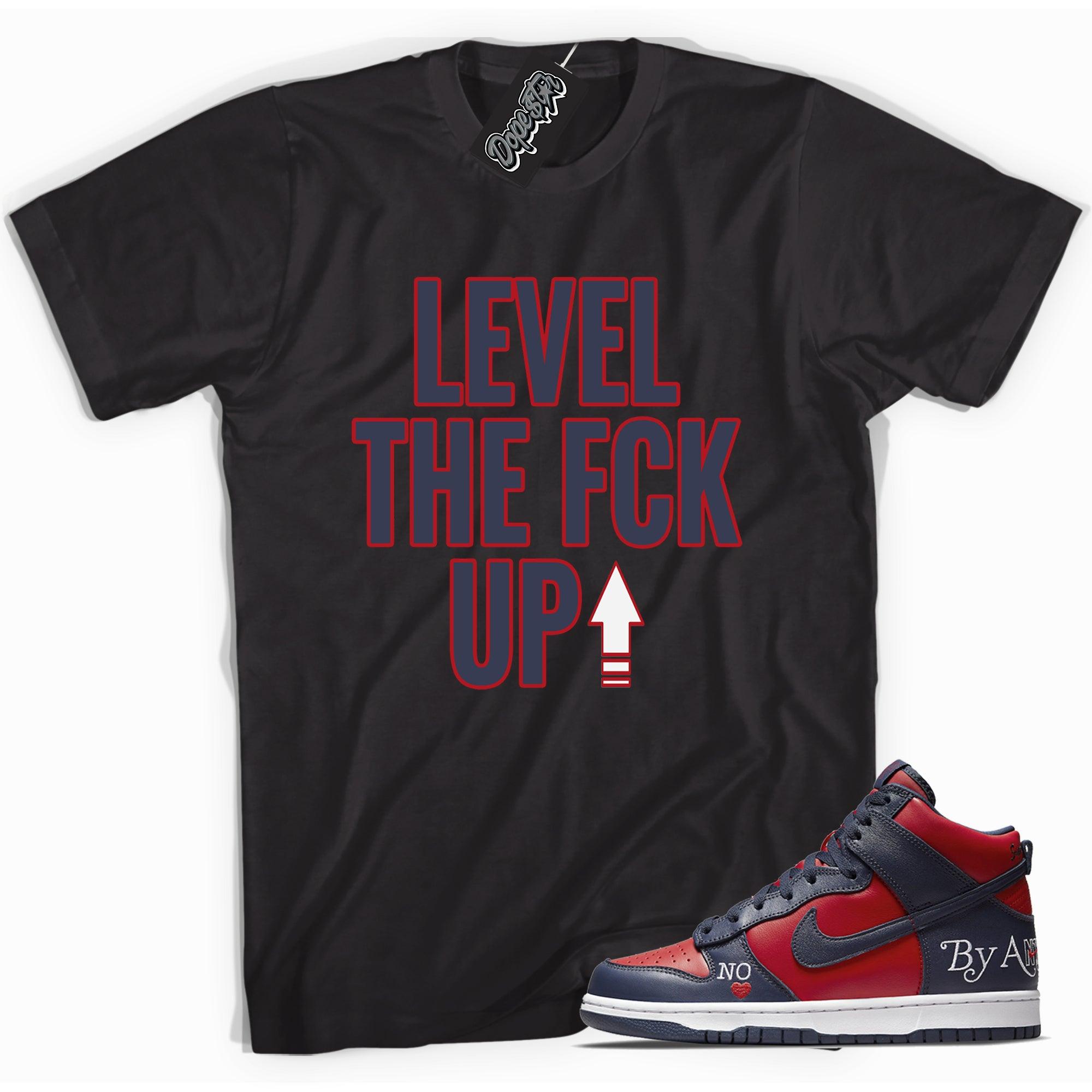 Cool black graphic tee with 'Level Up' print, that perfectly matches Nike SB Dunk High Supreme Navy Toe sneakers.