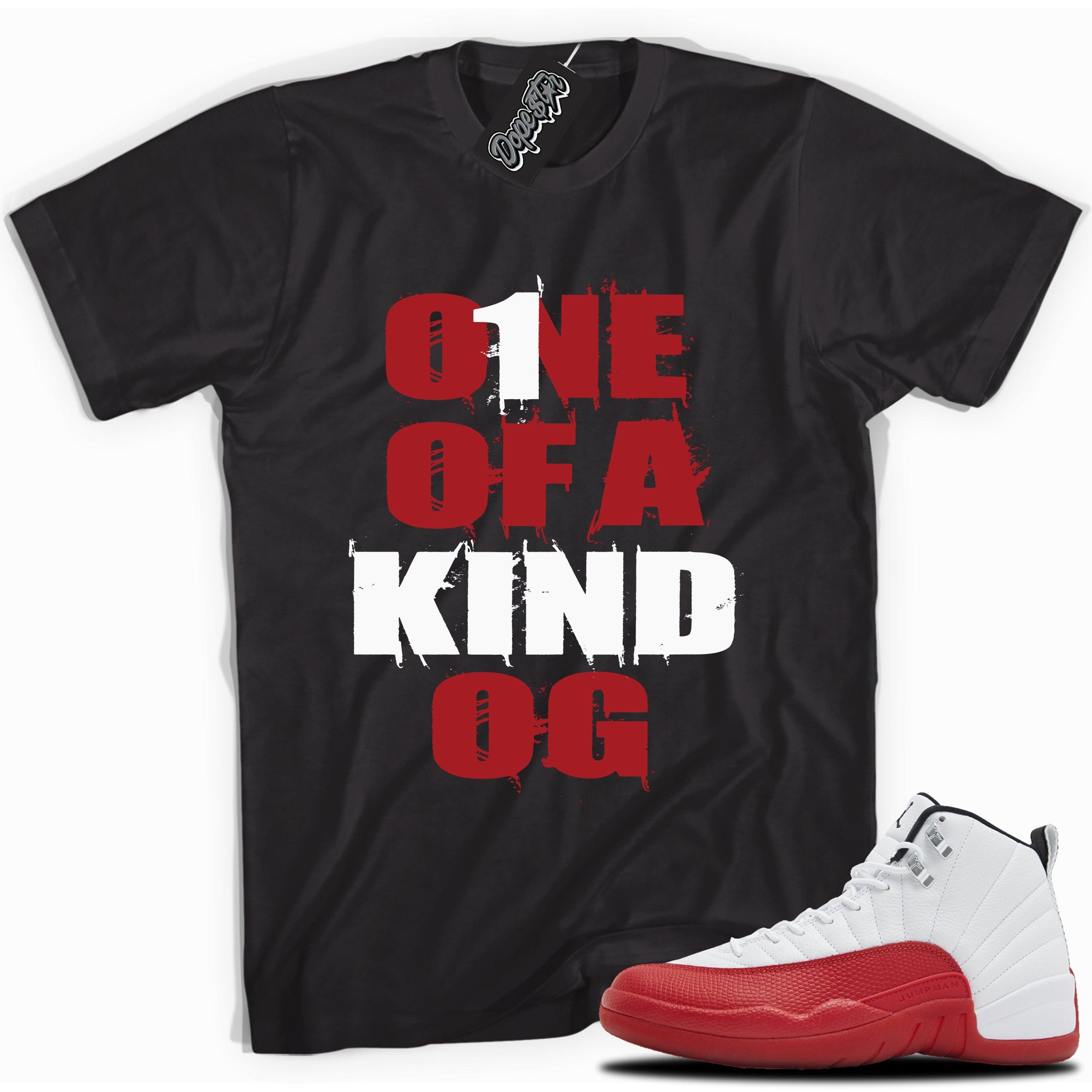 Cool Black graphic tee with “ONE OF A KIND OG” print, that perfectly matches Air Jordan 12 Retro Cherry Red 2023 red and white sneakers 