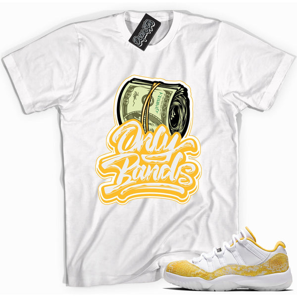 Cool white graphic tee with 'only bands' print, that perfectly matches Air Jordan 11 Retro Low Yellow Snakeskin sneakers