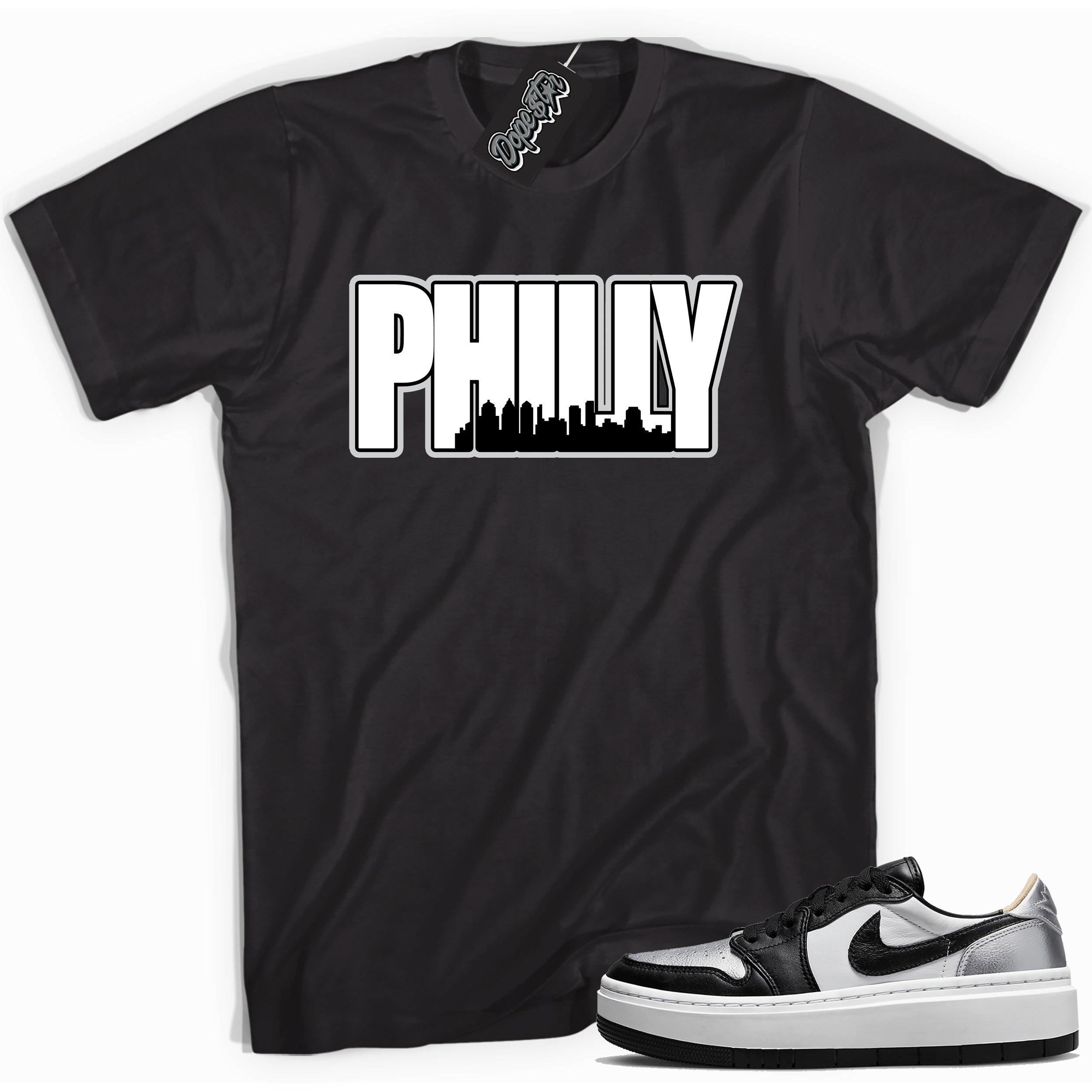 Cool black graphic tee with 'philly Philadelphia ' print, that perfectly matches Air Jordan 1 Elevate Low SE Silver Toe sneakers.