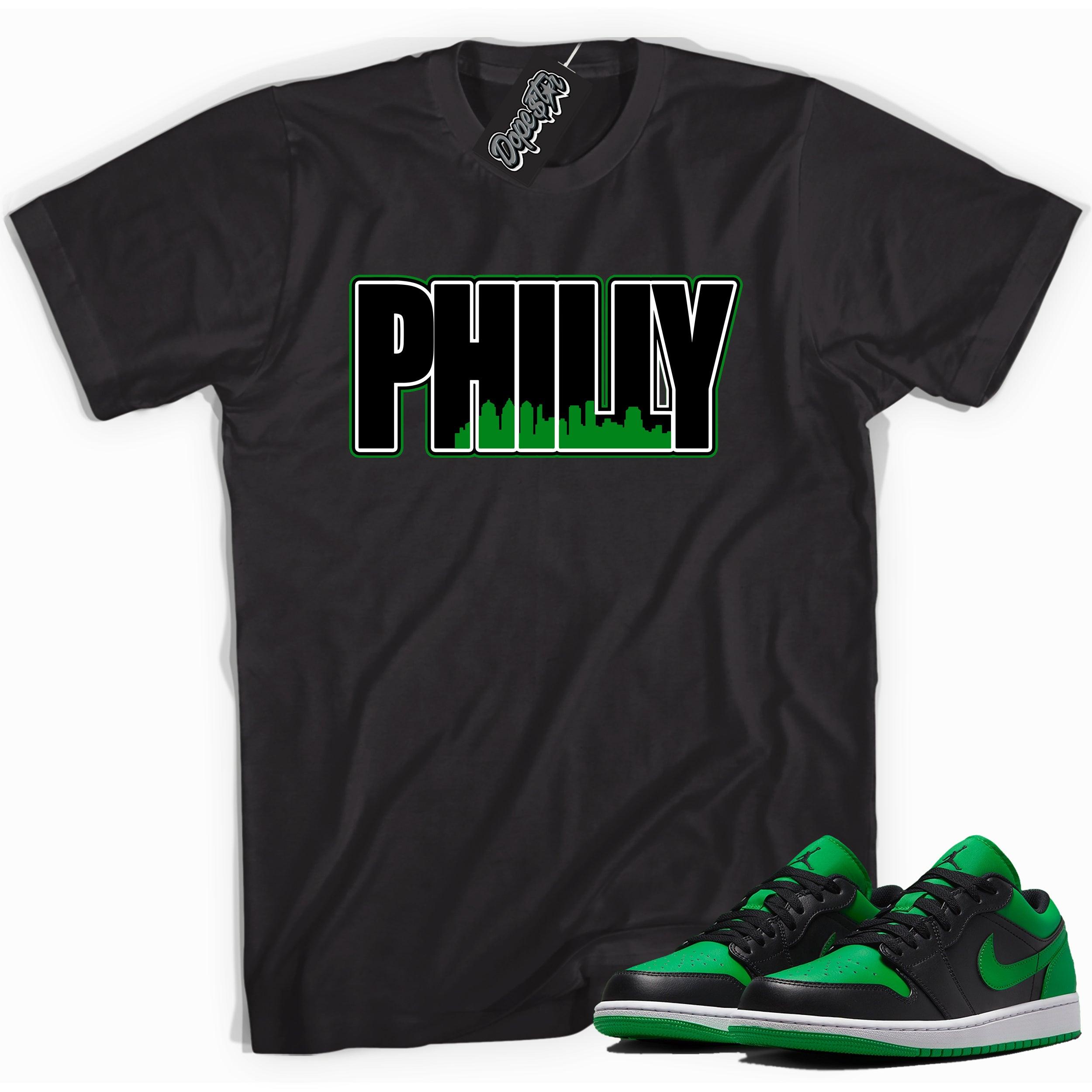 Cool black graphic tee with 'Philly' print, that perfectly matches Air Jordan 1 Low Lucky Green sneakers