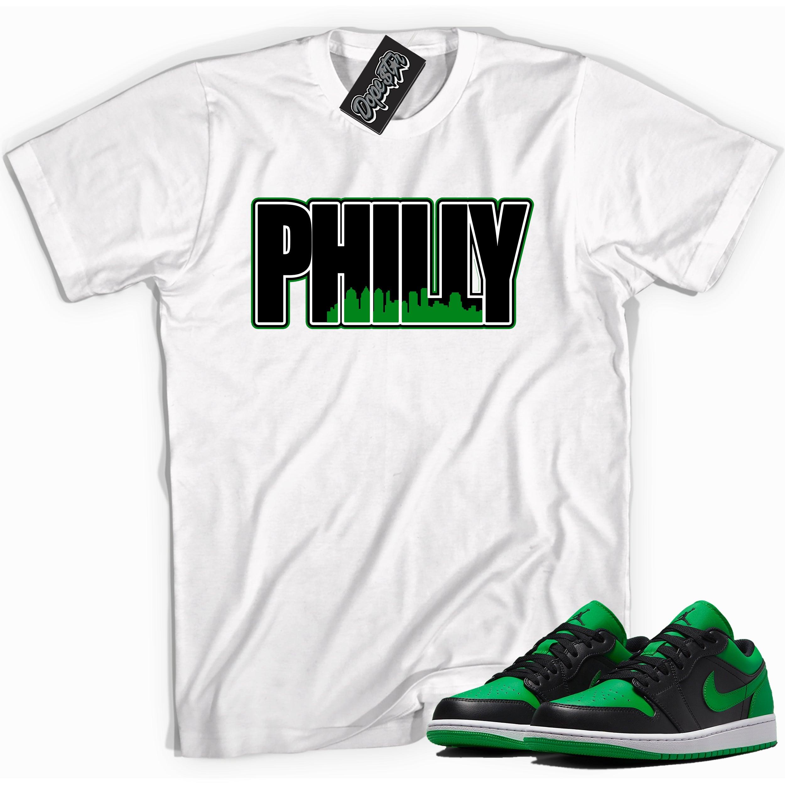 Cool white graphic tee with 'Philly' print, that perfectly matches Air Jordan 1 Low Lucky Green sneakers