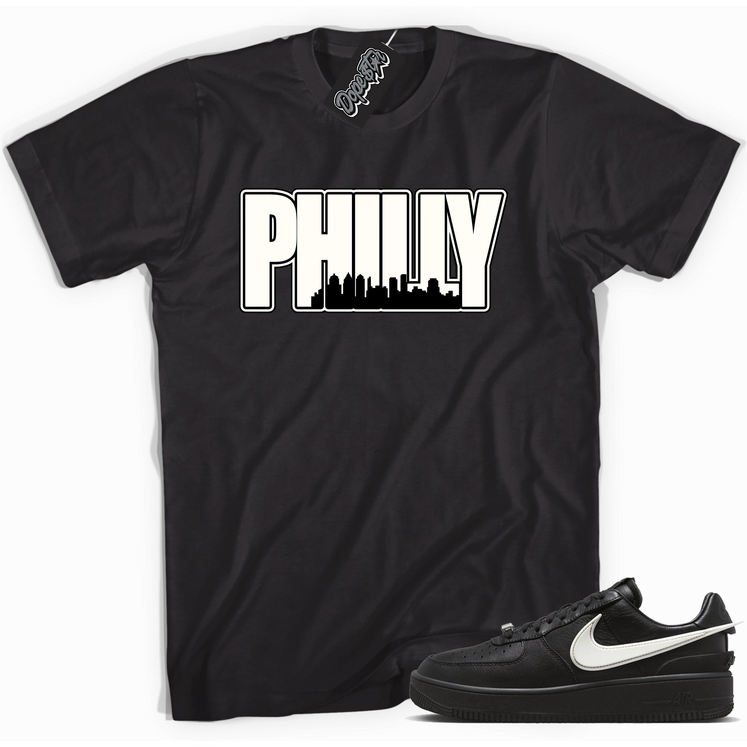 Cool black graphic tee with 'philly Philadelphia ' print, that perfectly matches Nike Air Force 1 Low SP Ambush Phantom sneakers.