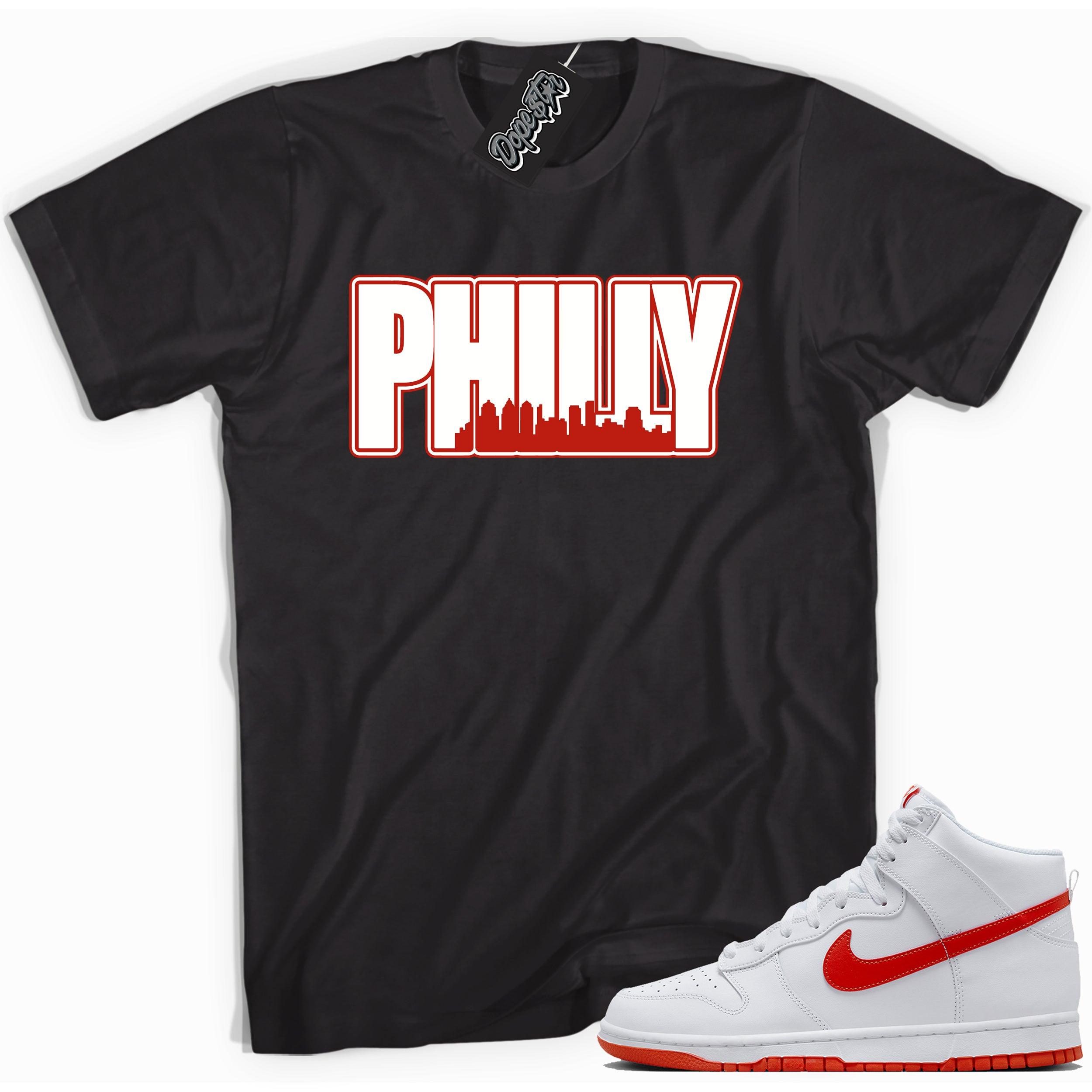 Cool black graphic tee with 'philly' print, that perfectly matches Nike Dunk High White Picante Red sneakers.