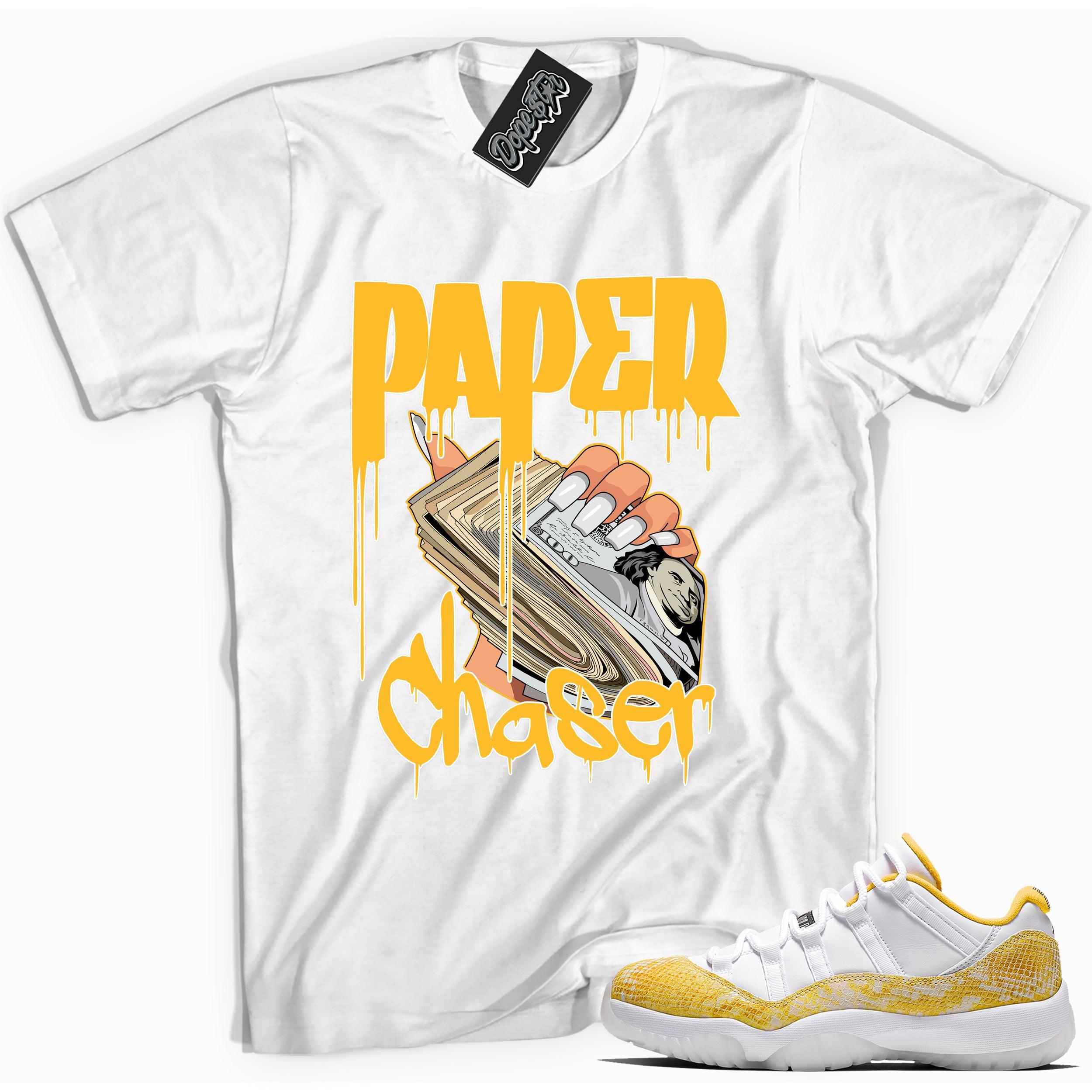 Cool white graphic tee with 'paper chaser' print, that perfectly matches Air Jordan 11 Retro Low Yellow Snakeskin sneakers