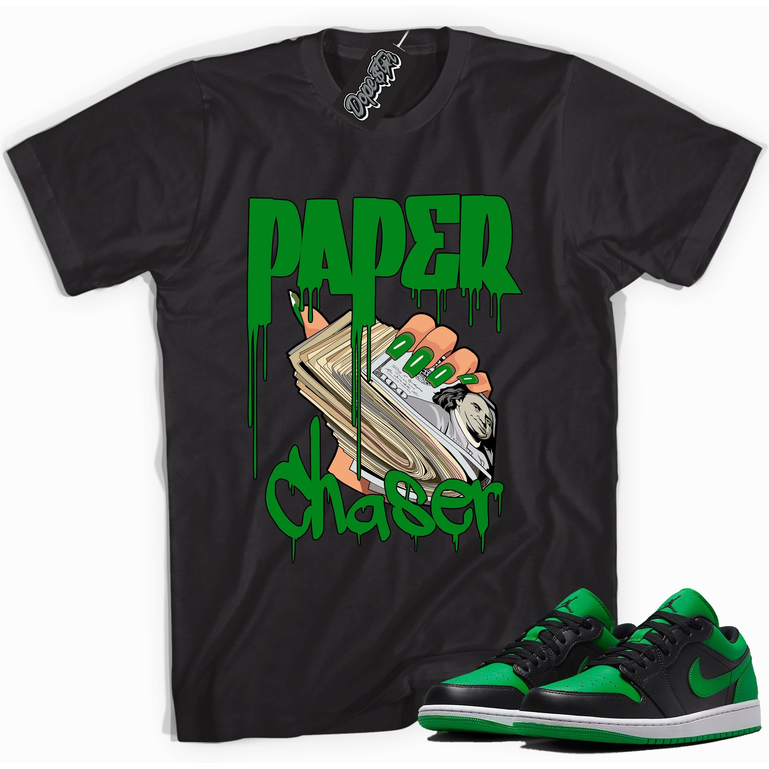 Cool black graphic tee with 'paper chaser' print, that perfectly matches Air Jordan 1 Low Lucky Green sneakers