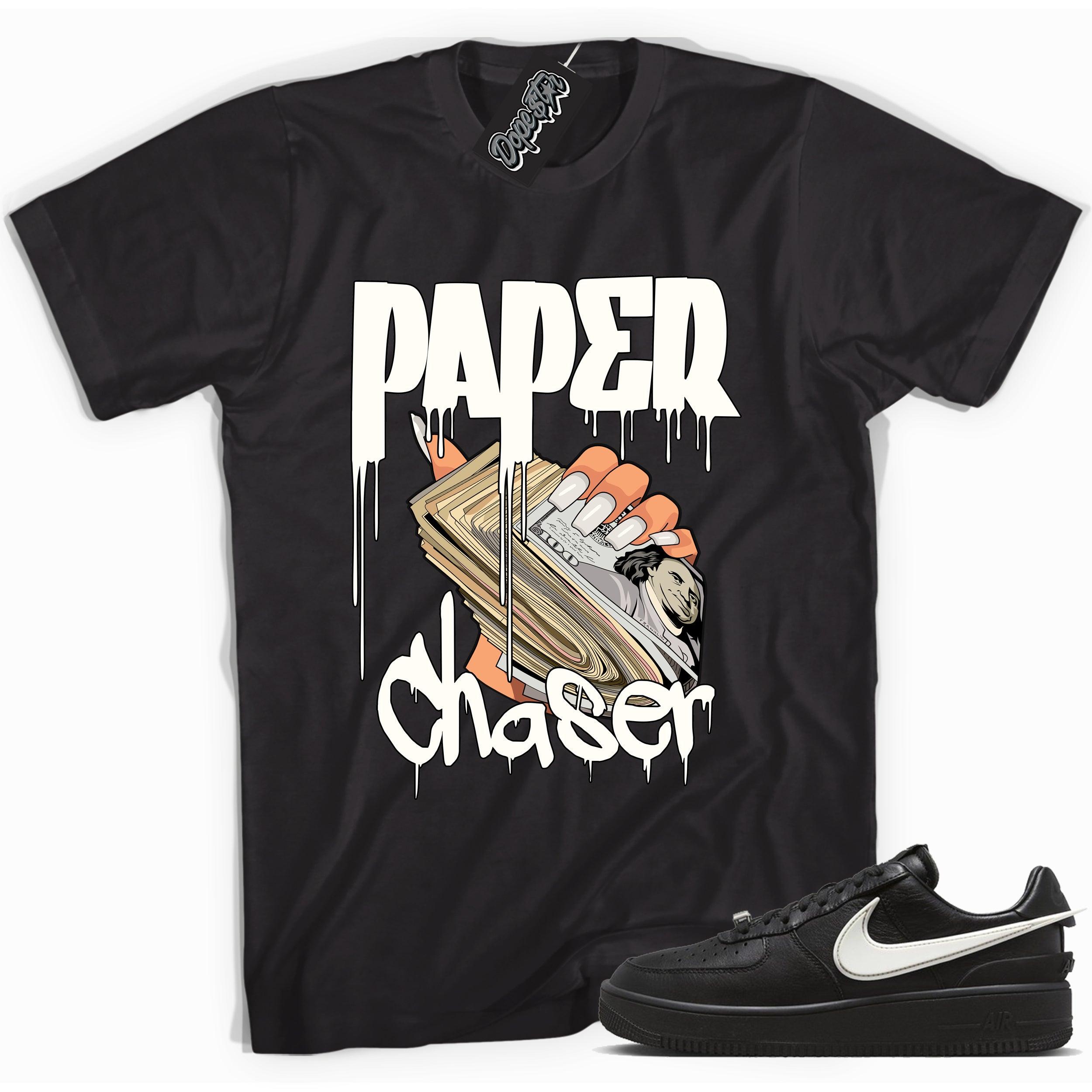 Cool black graphic tee with 'paper chaser' print, that perfectly matches Nike Air Force 1 Low SP Ambush Phantom sneakers.