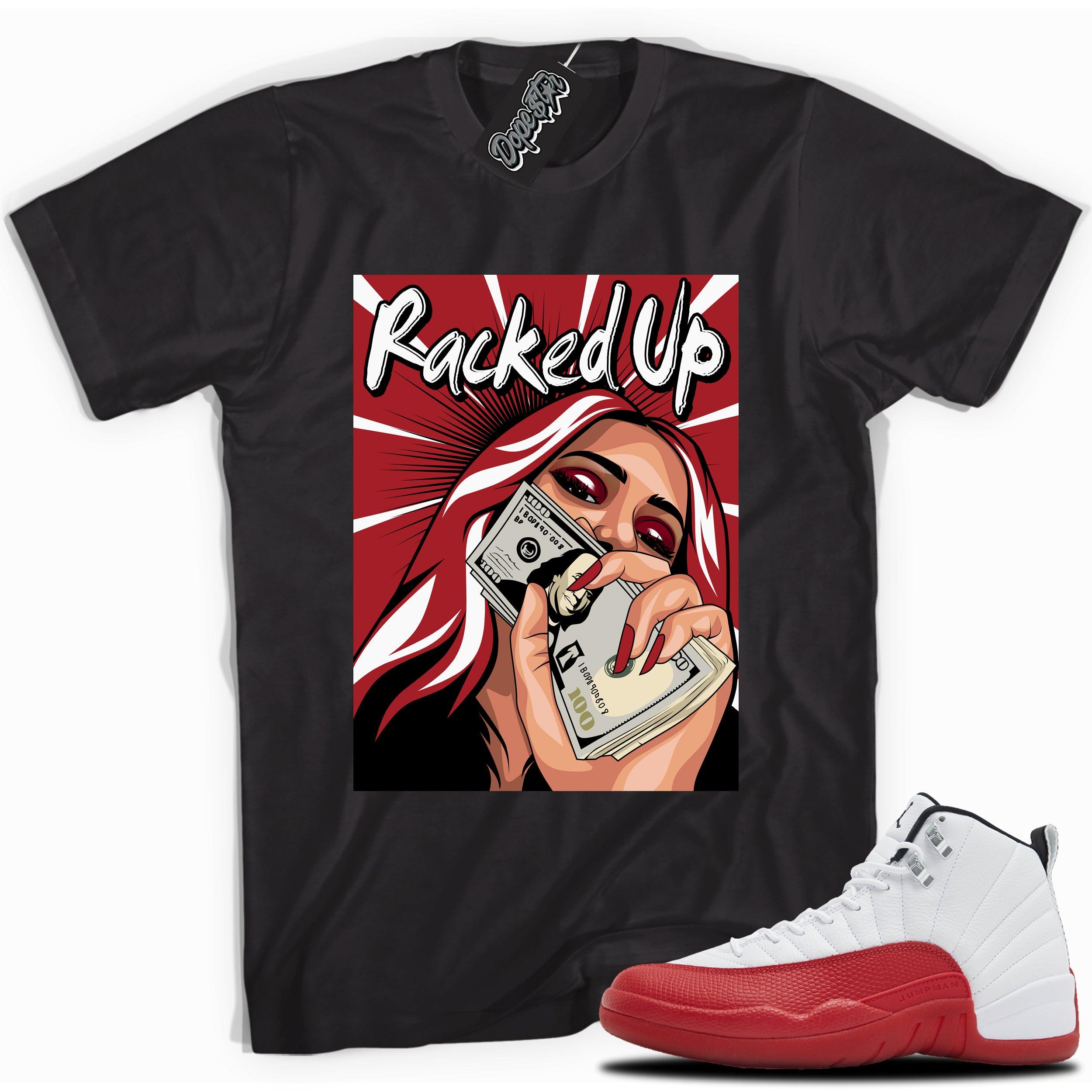 Cool Black graphic tee with “RACKED UP” print, that perfectly matches Air Jordan 12 Retro Cherry Red 2023 red and white sneakers 