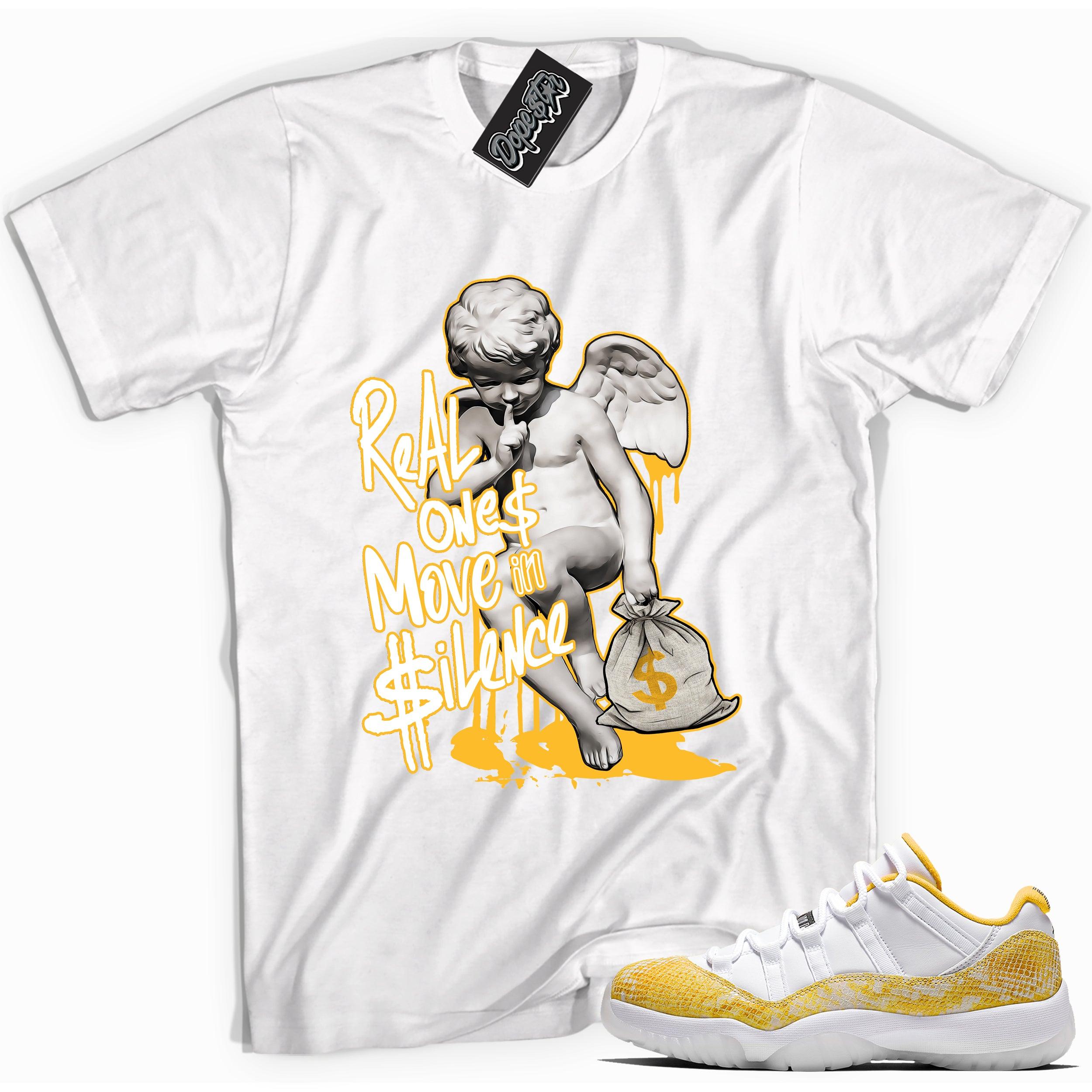 Cool white graphic tee with 'real ones move in silence' print, that perfectly matches Air Jordan 11 Retro Low Yellow Snakeskin sneakers