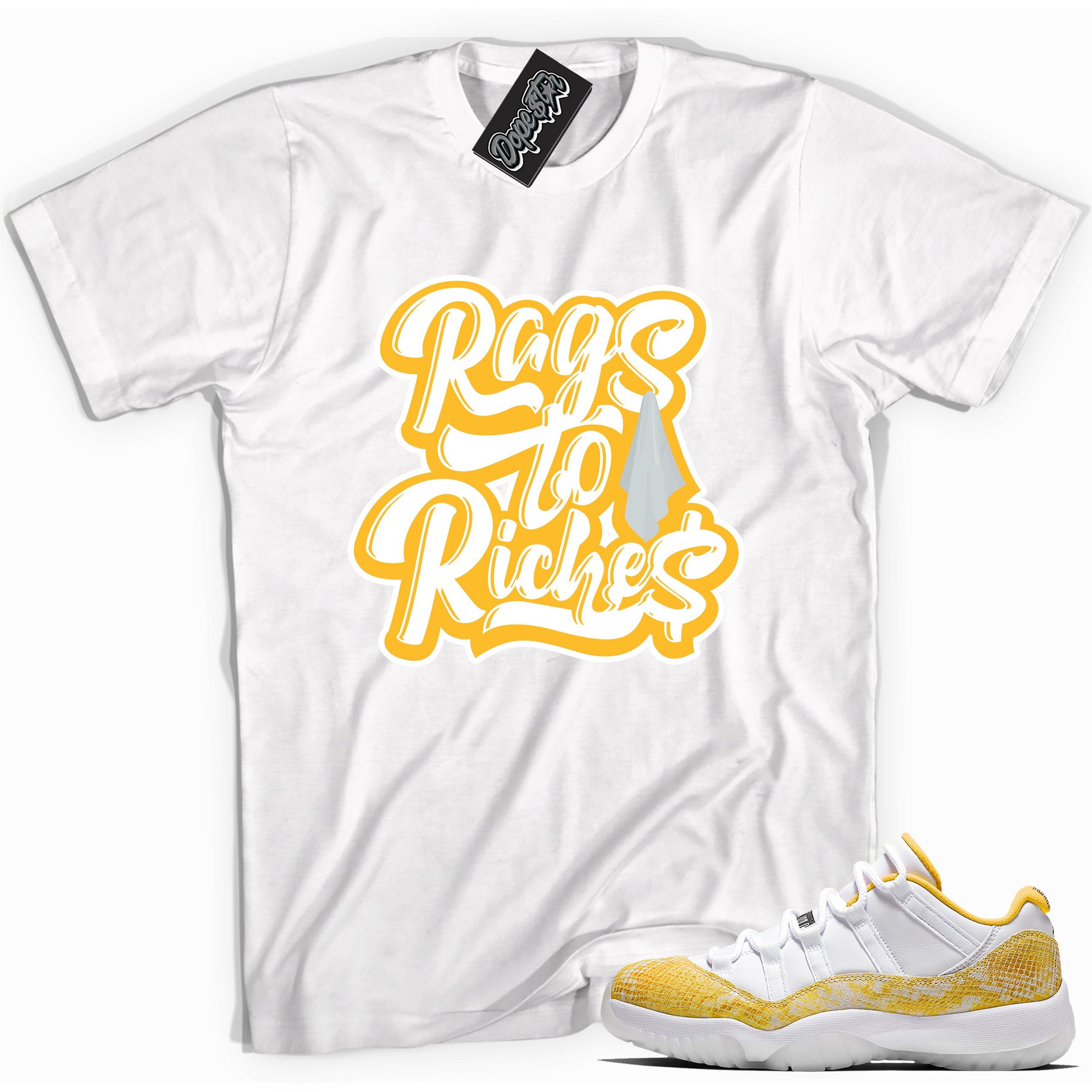 Cool white graphic tee with 'rags to riches' print, that perfectly matches Air Jordan 11 Retro Low Yellow Snakeskin sneakers