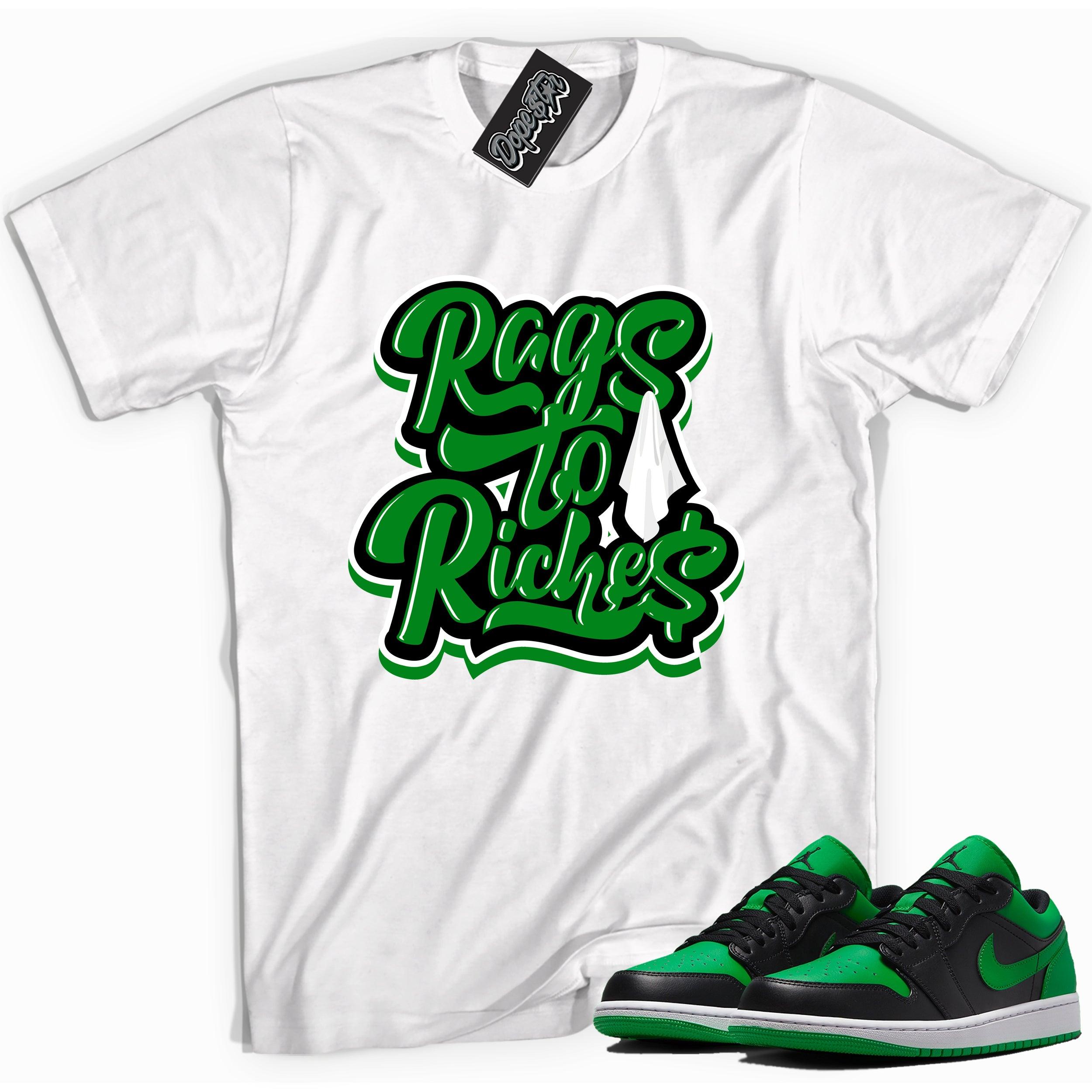 Cool white graphic tee with 'rags to riches' print, that perfectly matches Air Jordan 1 Low Lucky Green sneakers