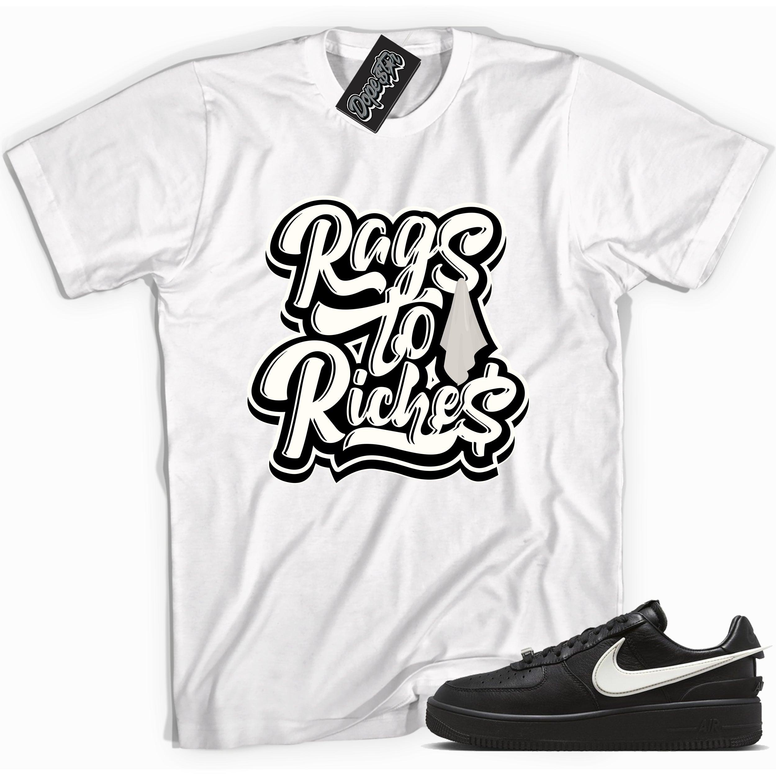 Cool white graphic tee with 'rags to riches' print, that perfectly matches Nike Air Force 1 Low SP Ambush Phantom sneakers.
