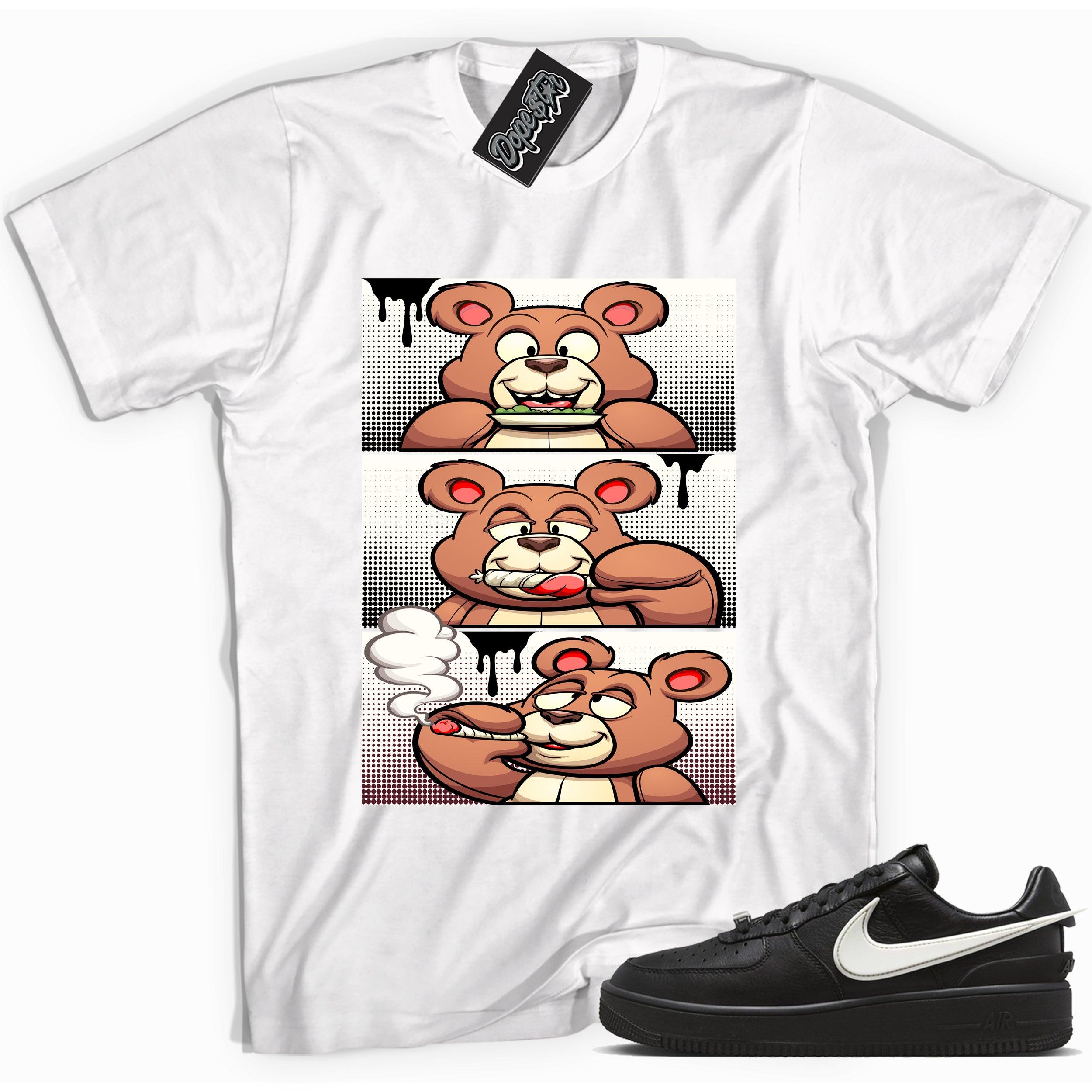 Cool white graphic tee with 'roll it lick it smoke it bear' print, that perfectly matches Nike Air Force 1 Low Ambush Phantom Black sneakers