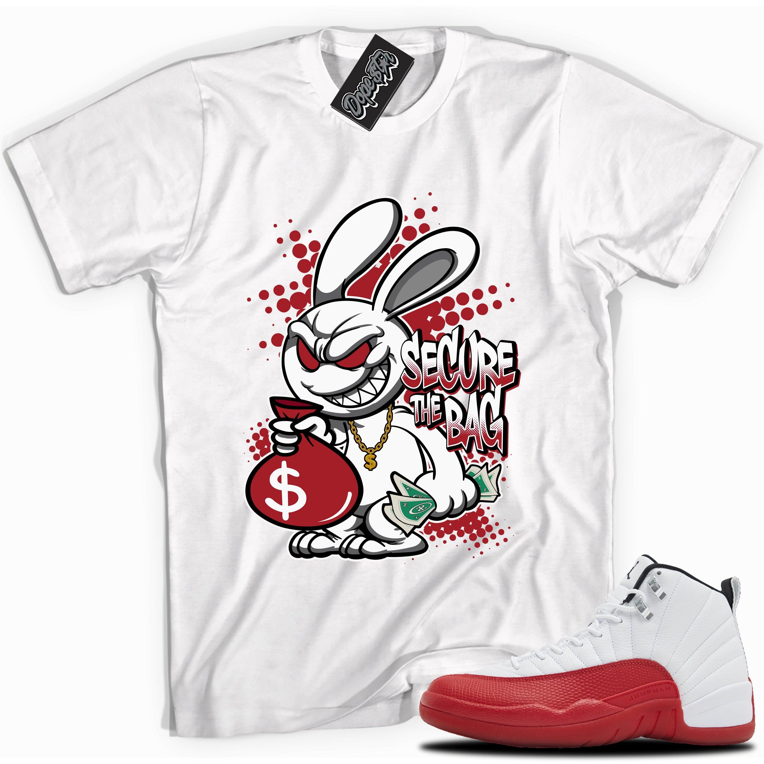 Cool White graphic tee with “SECURE THE BAG” print, that perfectly matches Air Jordan 12 Retro Cherry Red 2023 red and white sneakers